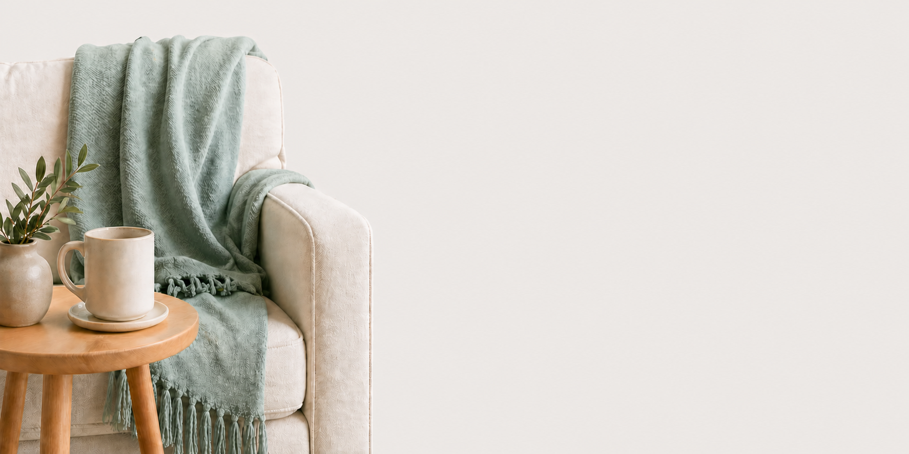 Calming neutral-toned therapy space with chair, blanket, plant and mug symbolizing healing from emotionally immature parents and childhood emotional neglect