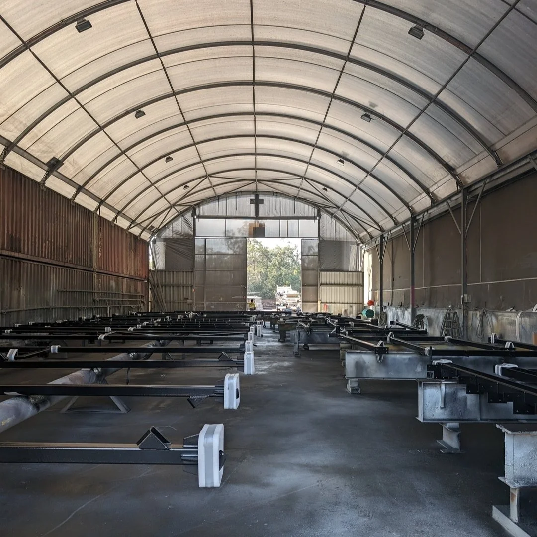 this first shot is called &quot;painting steel in  a big shed&quot;. We actually are quite excited by the shed it looks a nice space. Liza visited it last week to inspect the first batch of steel being painted (over hot dip galvanizing) before being 