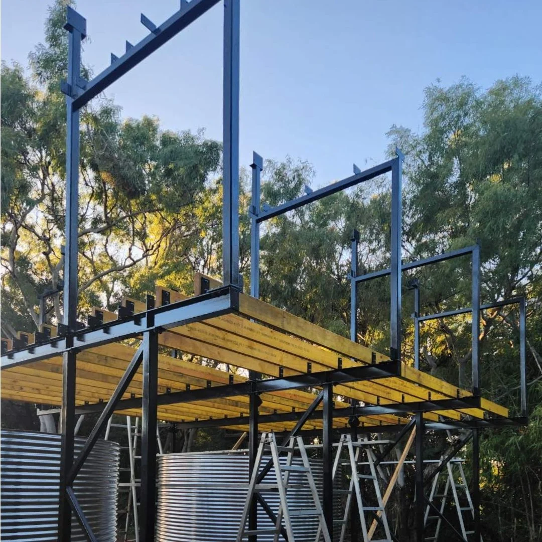 ...steel painted, steel on site. A nice photo here from Mike our no. 1 builder (Mike Murry Homes, Agnes Water). Also quite artistic - somewhat surprising perhaps from someone who has referred to his two index fingers as 'seek' and 'destroy' (more in 