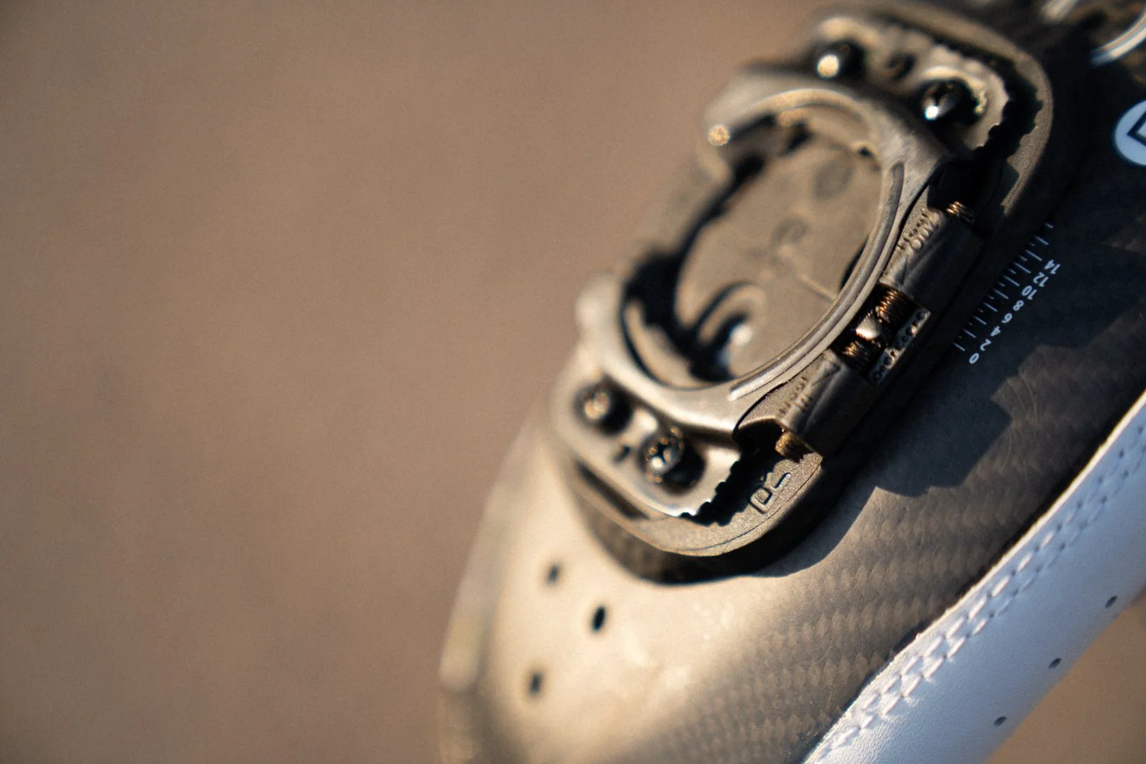 Close-up of the float limiter screws on a Wahoo Speedplay cleat, the two small screws that set how far the heel rotates before the cleat releases.
