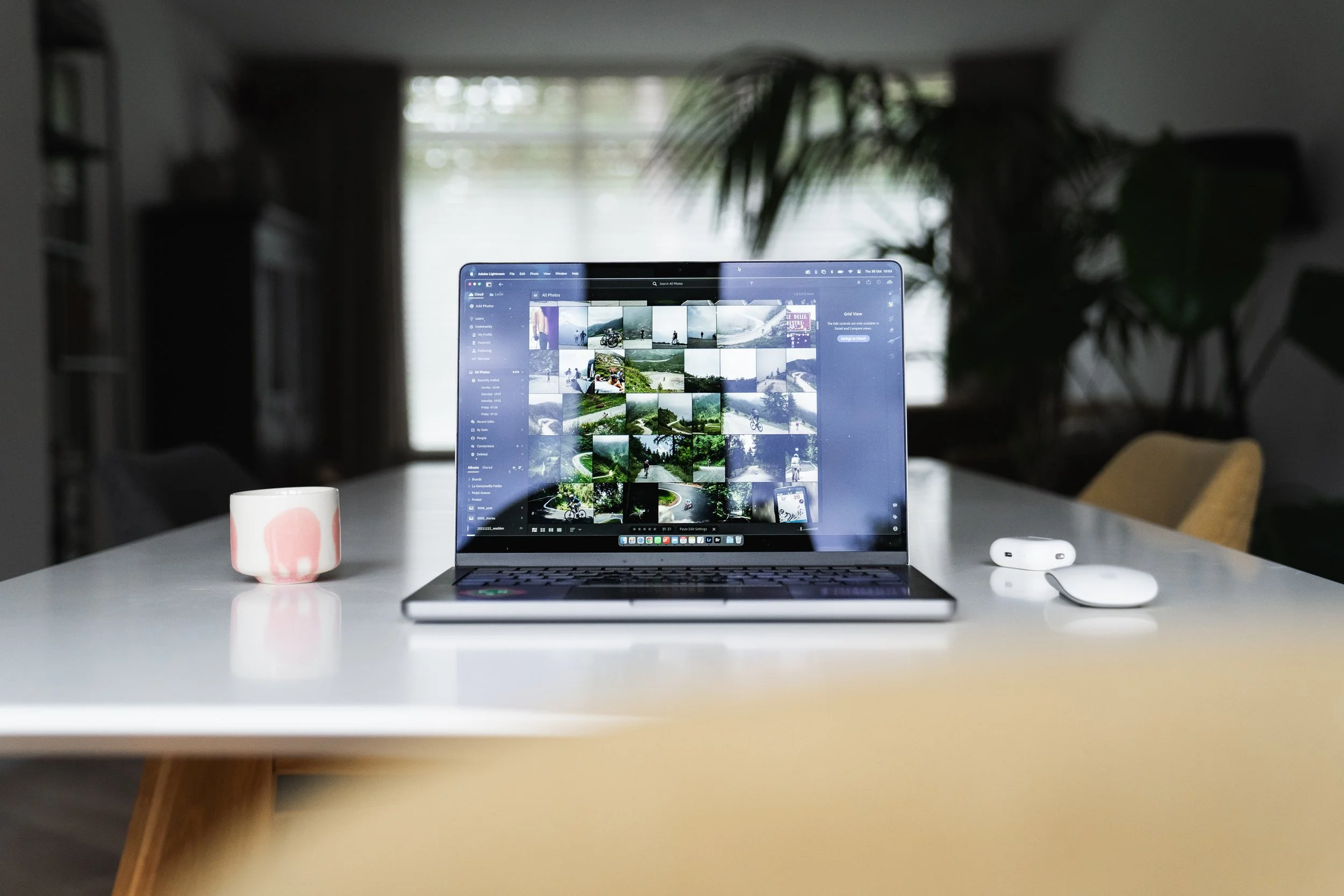 Rik de Voogd’s laptop showing his Lightroom library full of photos, representing the freedom of creating on your own terms as a professional photographer.