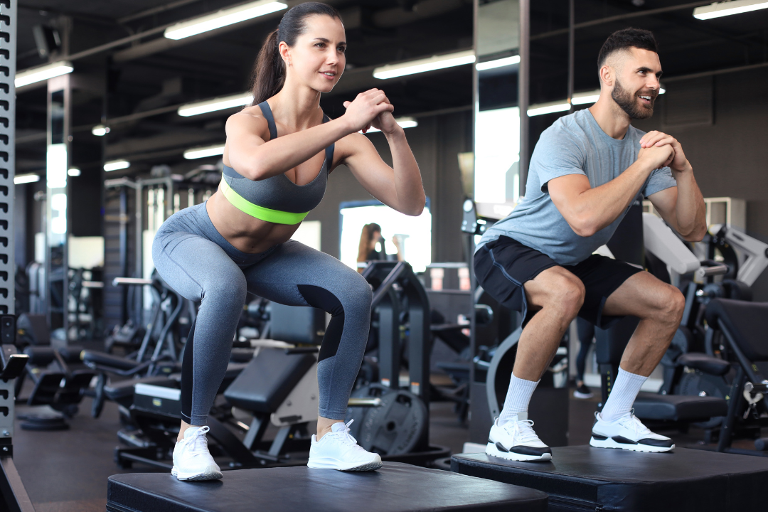 Two people exercising together to get stronger