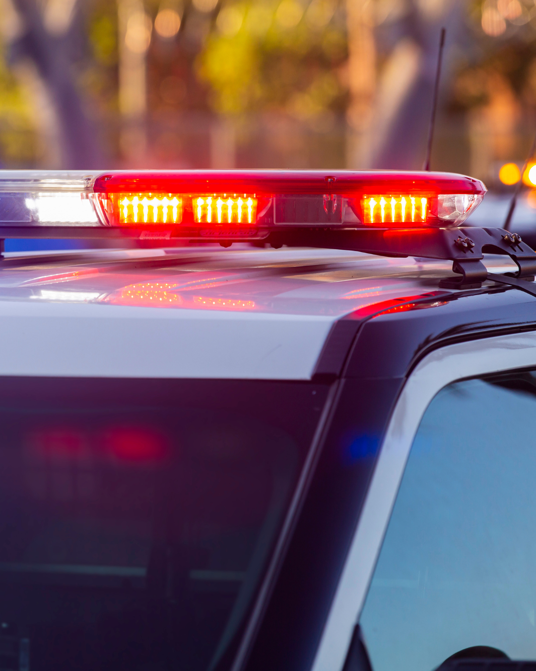 Emergency vehicle with flashing lights.