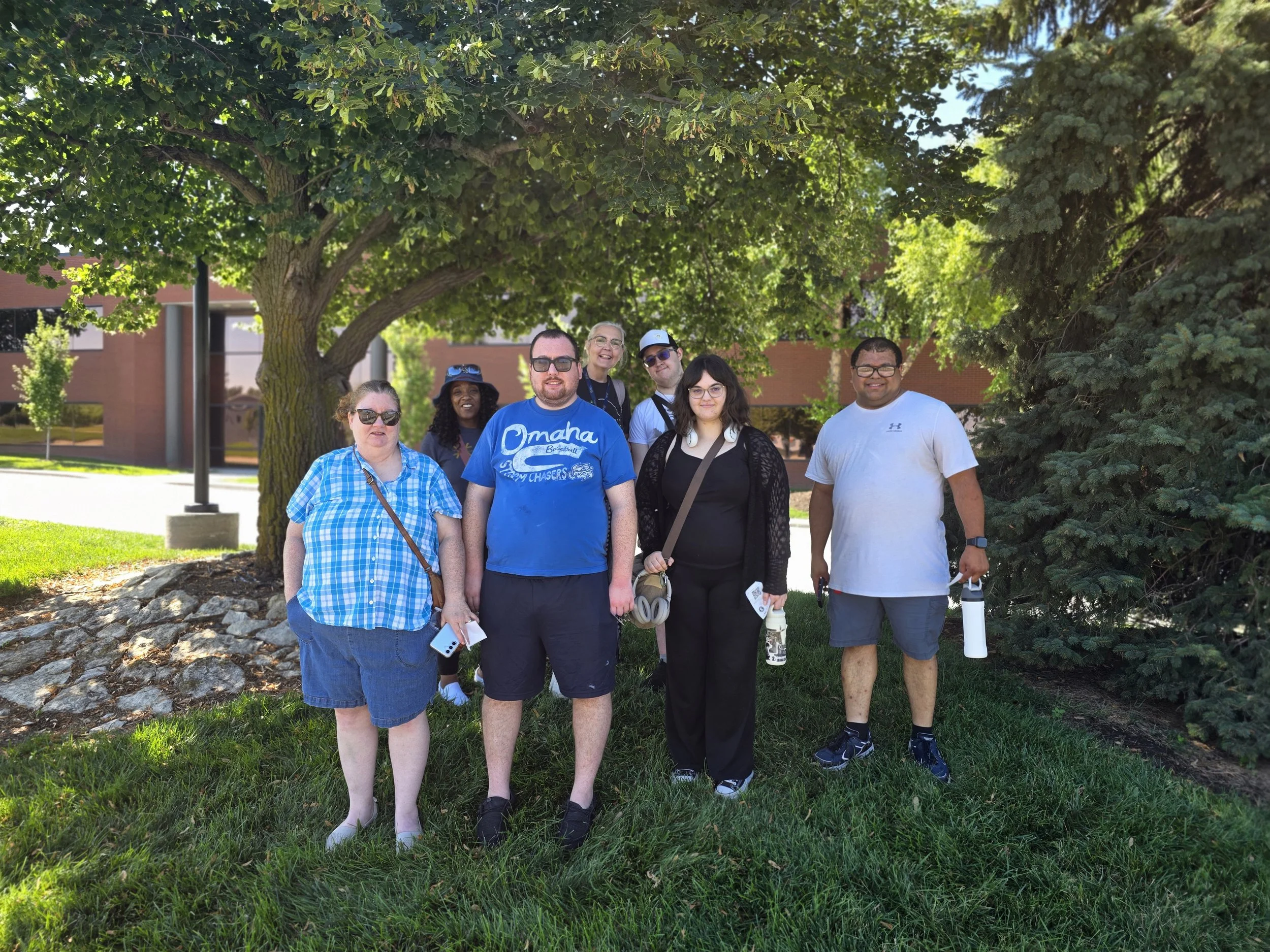 Group smiling for a picture outside