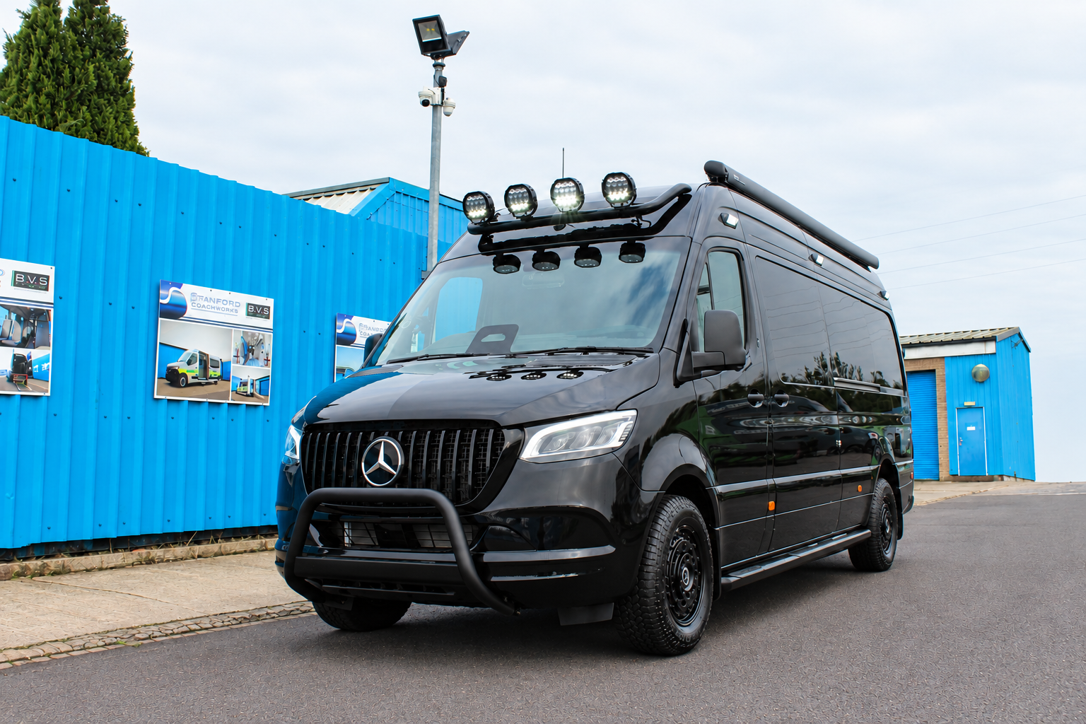 Glossy Black Sprinter at Coachworks Yard.png