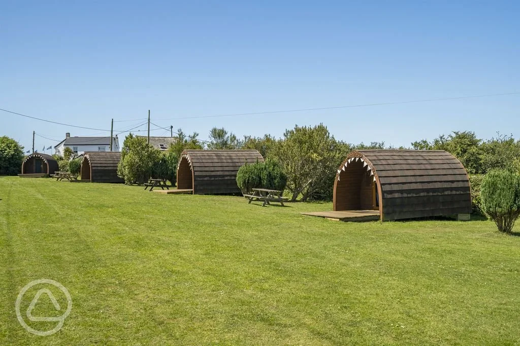 glamping-pods-with-decking-and-picnic-benches.jpg