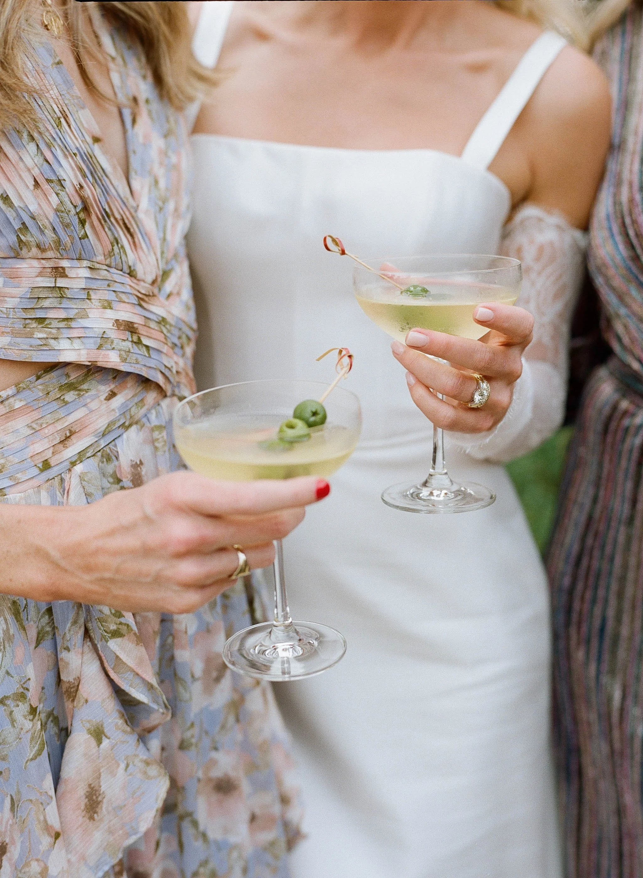 Bride holding martini glass during cocktail hour, candid film wedding photography, Big Sur California