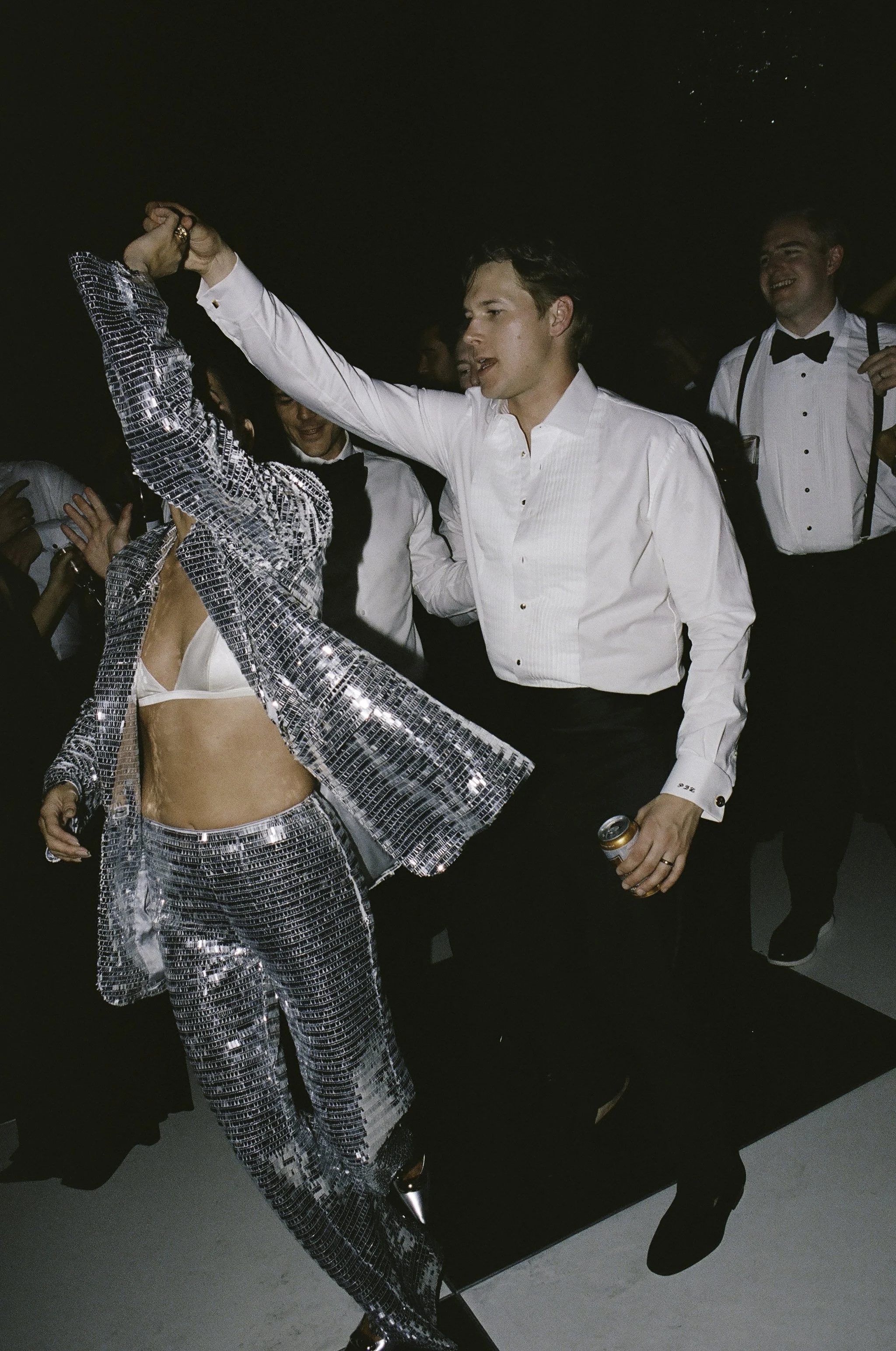Candid documentary dance floor moment at wedding reception — film photography by Radostina Boseva