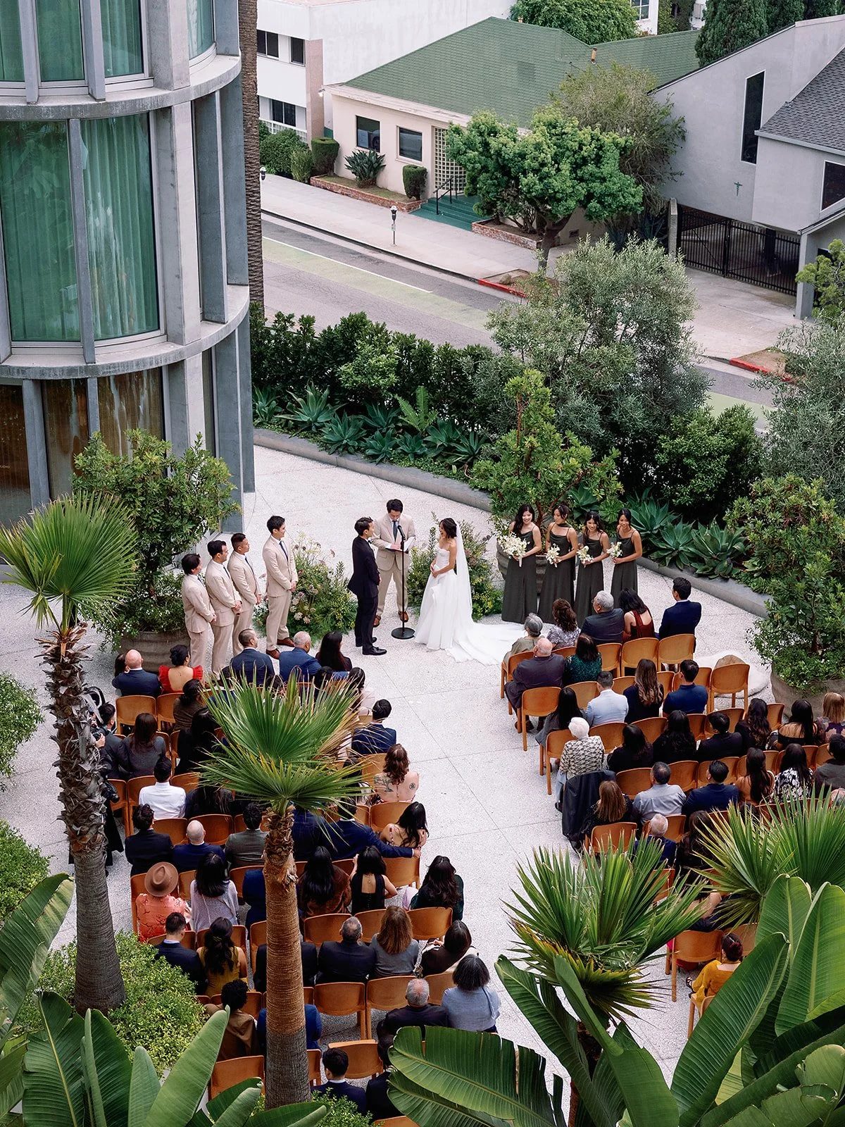 Outdoor wedding ceremony at Santa Monica Proper Hotel — film wedding photography by Radostina Boseva