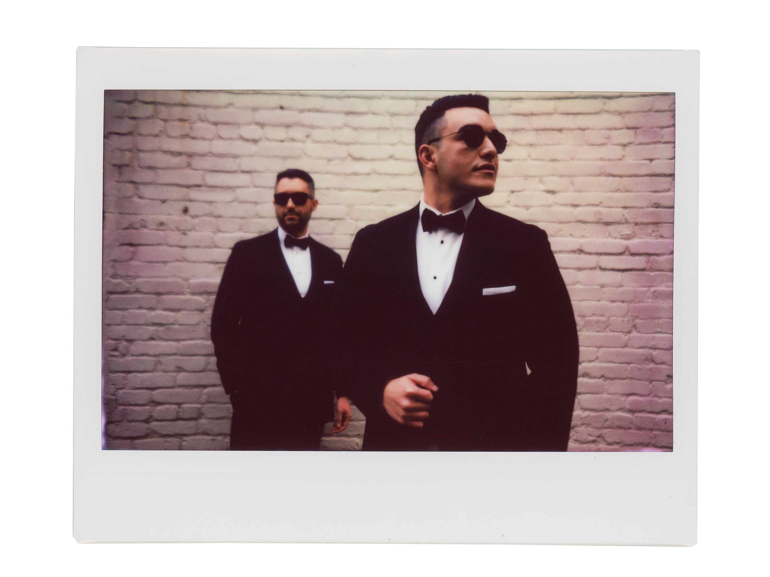 Polaroid documentary portrait of two grooms at wedding — film photography by Radostina Boseva