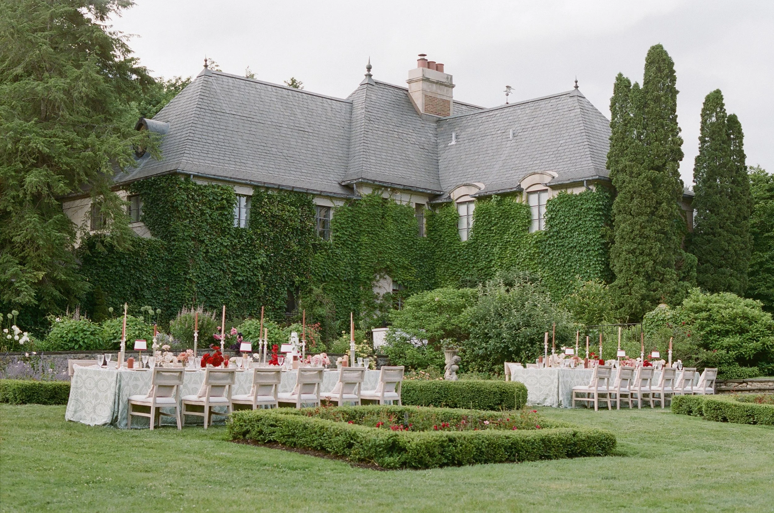 Outdoor wedding reception tables in formal garden at a private estate — film wedding photography by San Francisco photographer Radostina Boseva