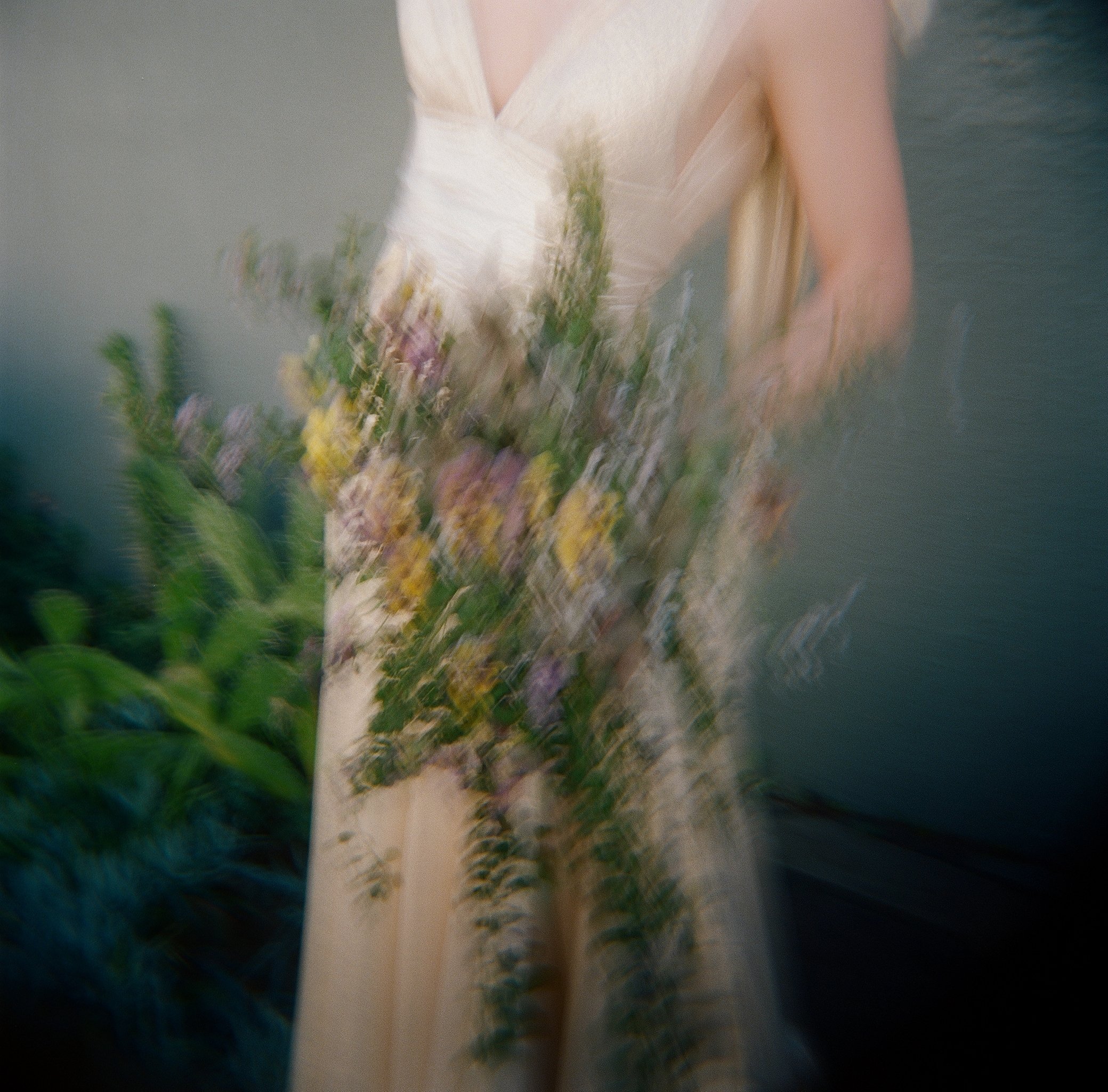 Close-up of bride holding wildflower bouquet in natural light — film wedding photography, San Francisco