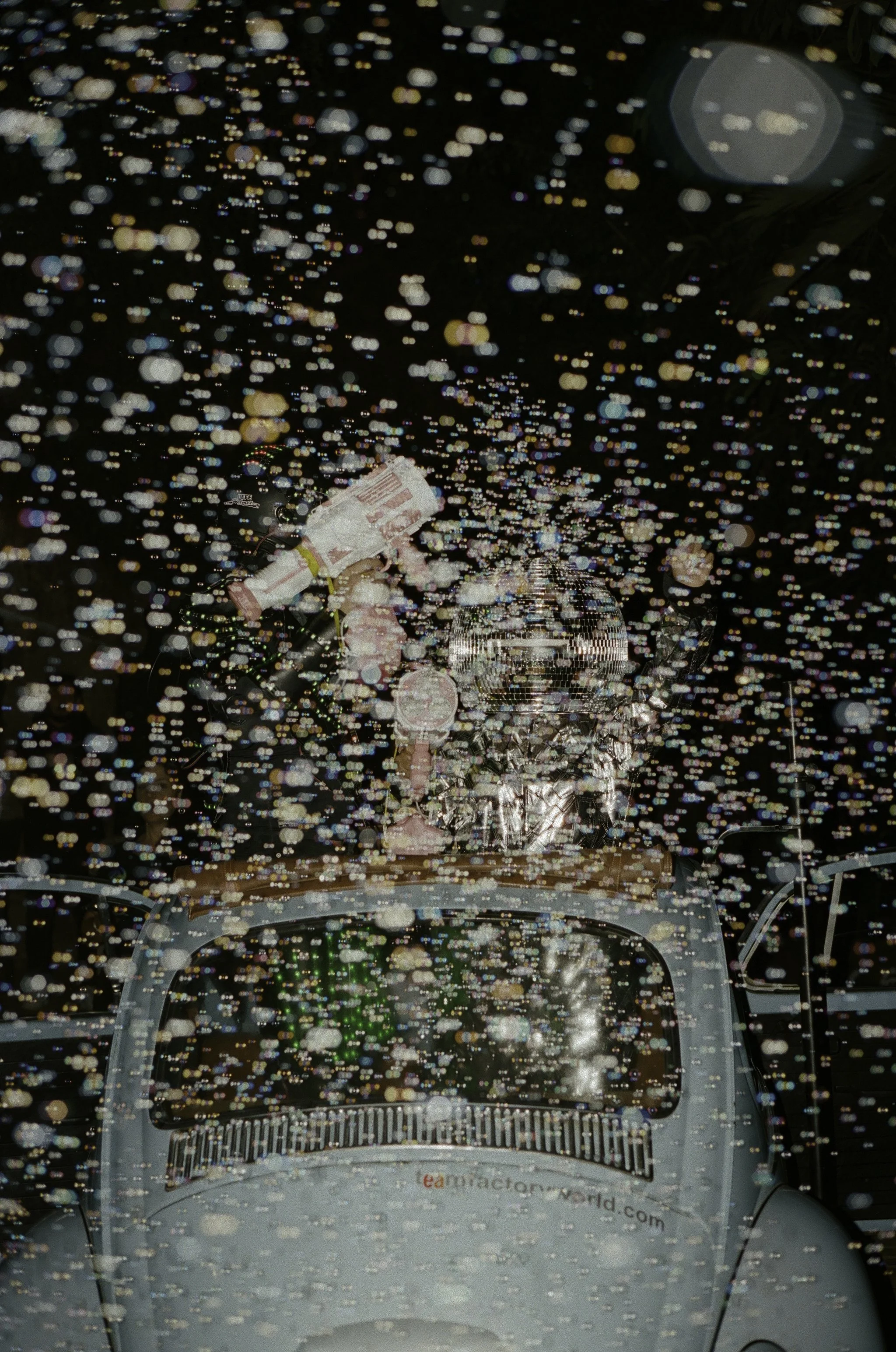Aerial documentary confetti exit at wedding reception — film photography by Radostina Boseva