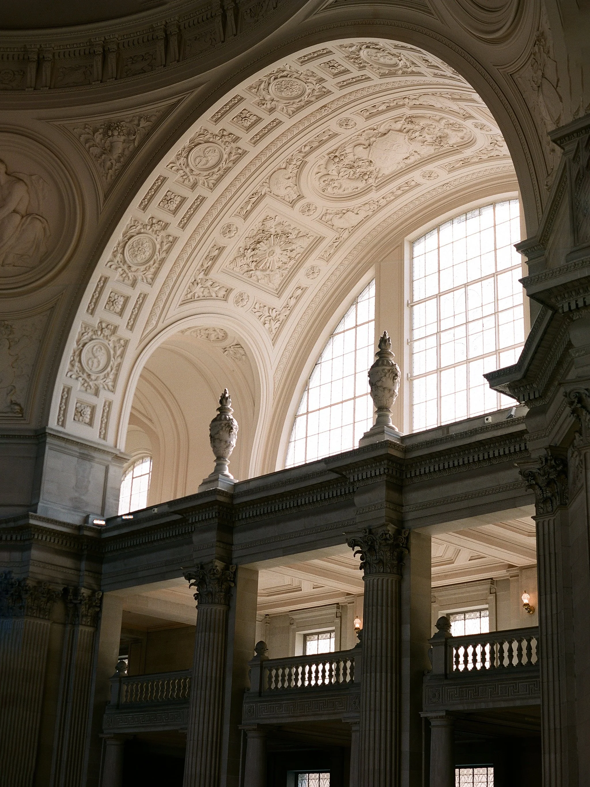 San Francisco City Hall interior — grand arched ceiling, ornate columns and natural light, photographed on film by Radostina Boseva