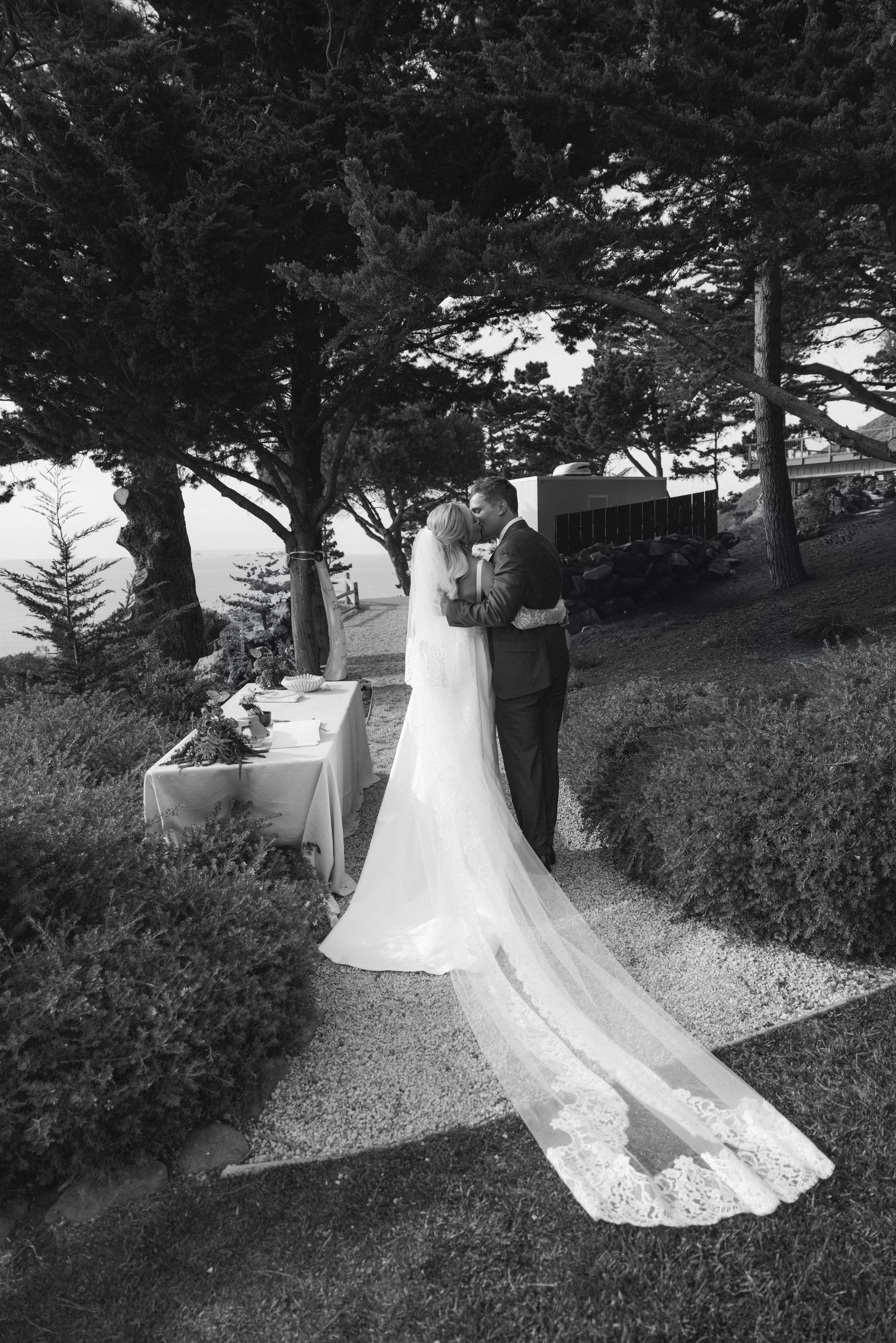 film photograph of couple kissing after ceremony in private estate in big sur
