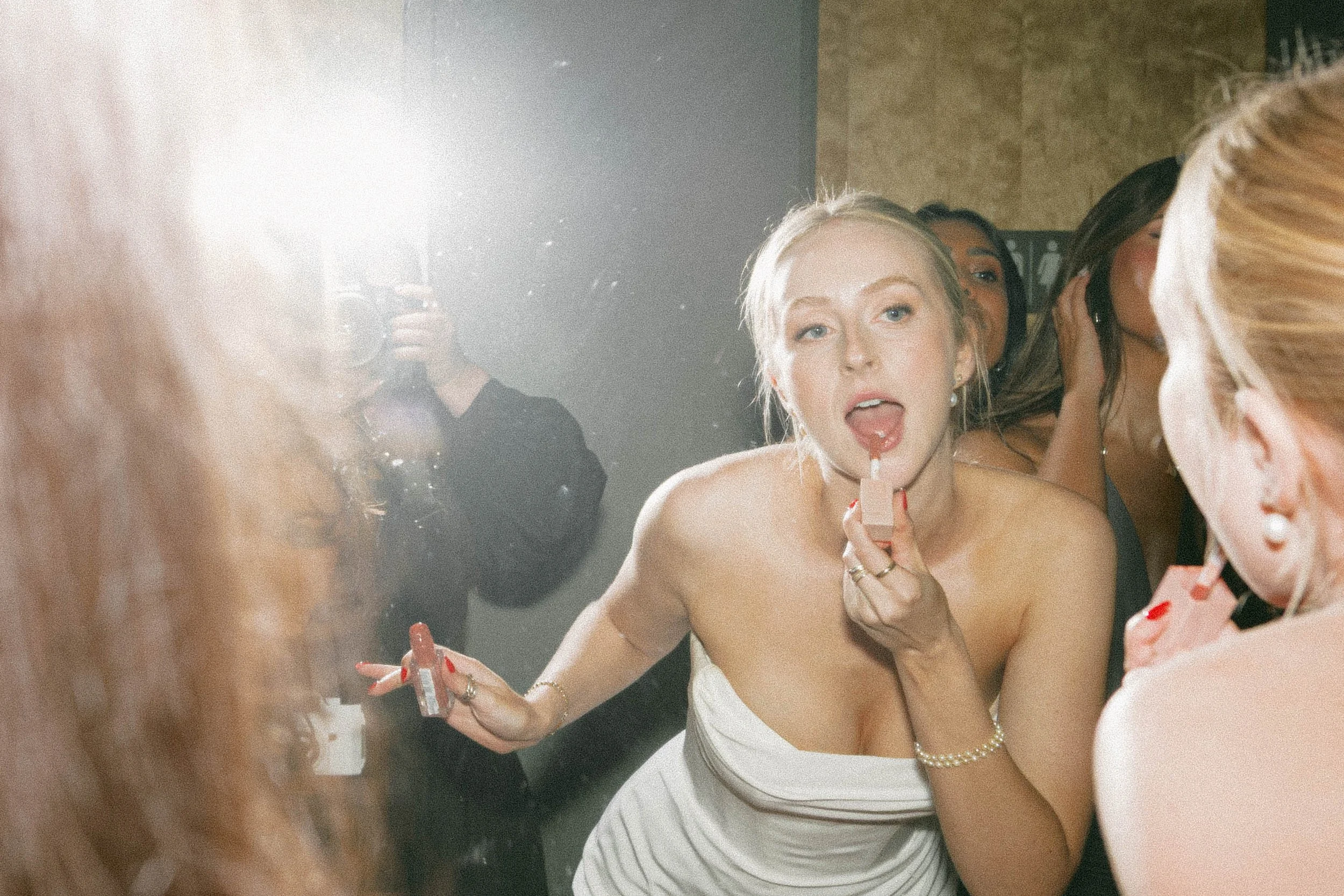 Candid documentary moment of bride getting ready at wedding reception — film photography by Radostina Boseva