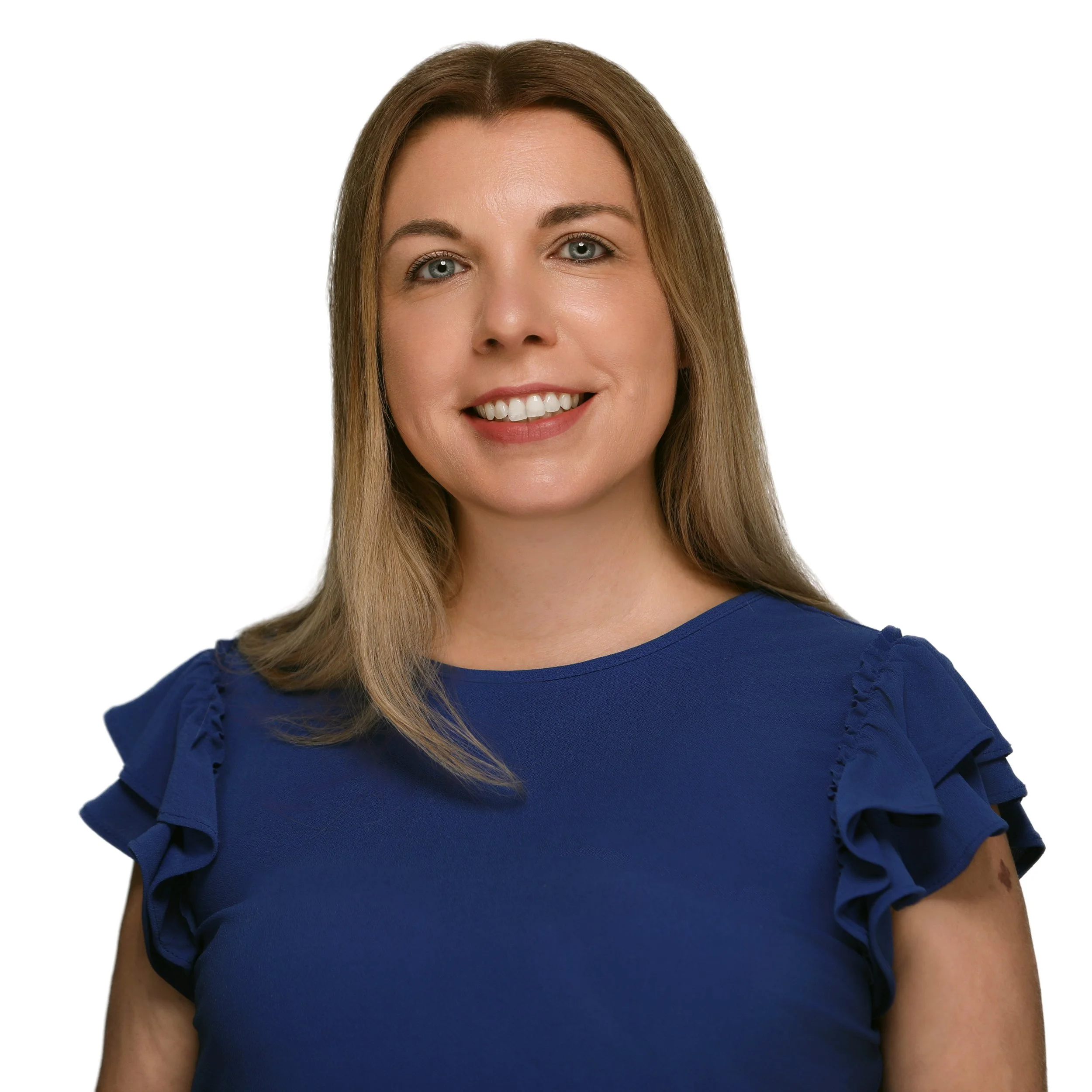 Professional female corporate headshot featuring a blue blouse and a clean white studio background.