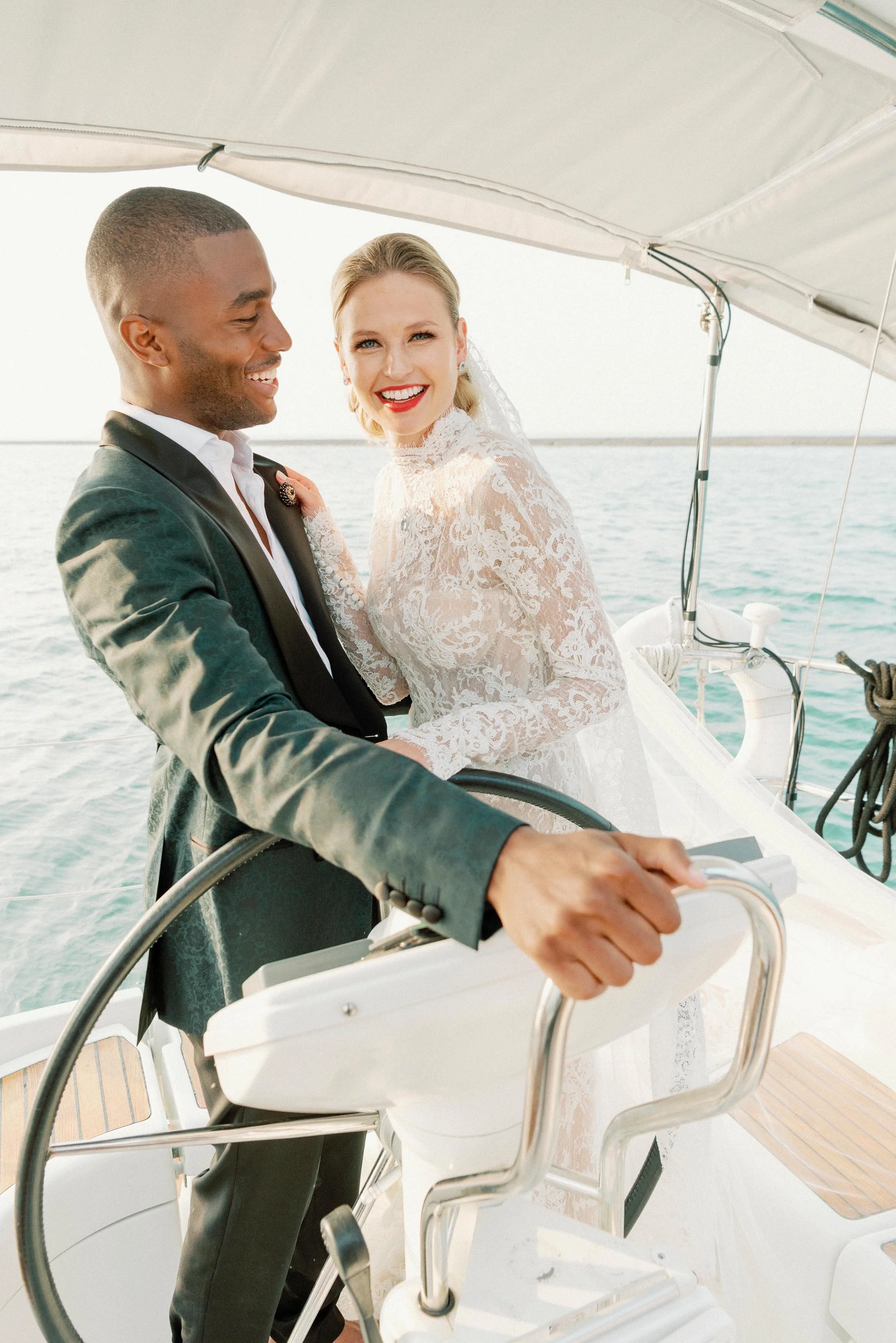 bride and groom smiling on a boat in Chicago