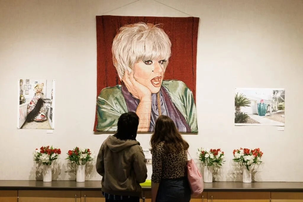 Heklina memorial installation with photos by Jose A Guzman Colon and tapestry by Joseph Abbati (soft defiance, 2023) by Vita Hewitt