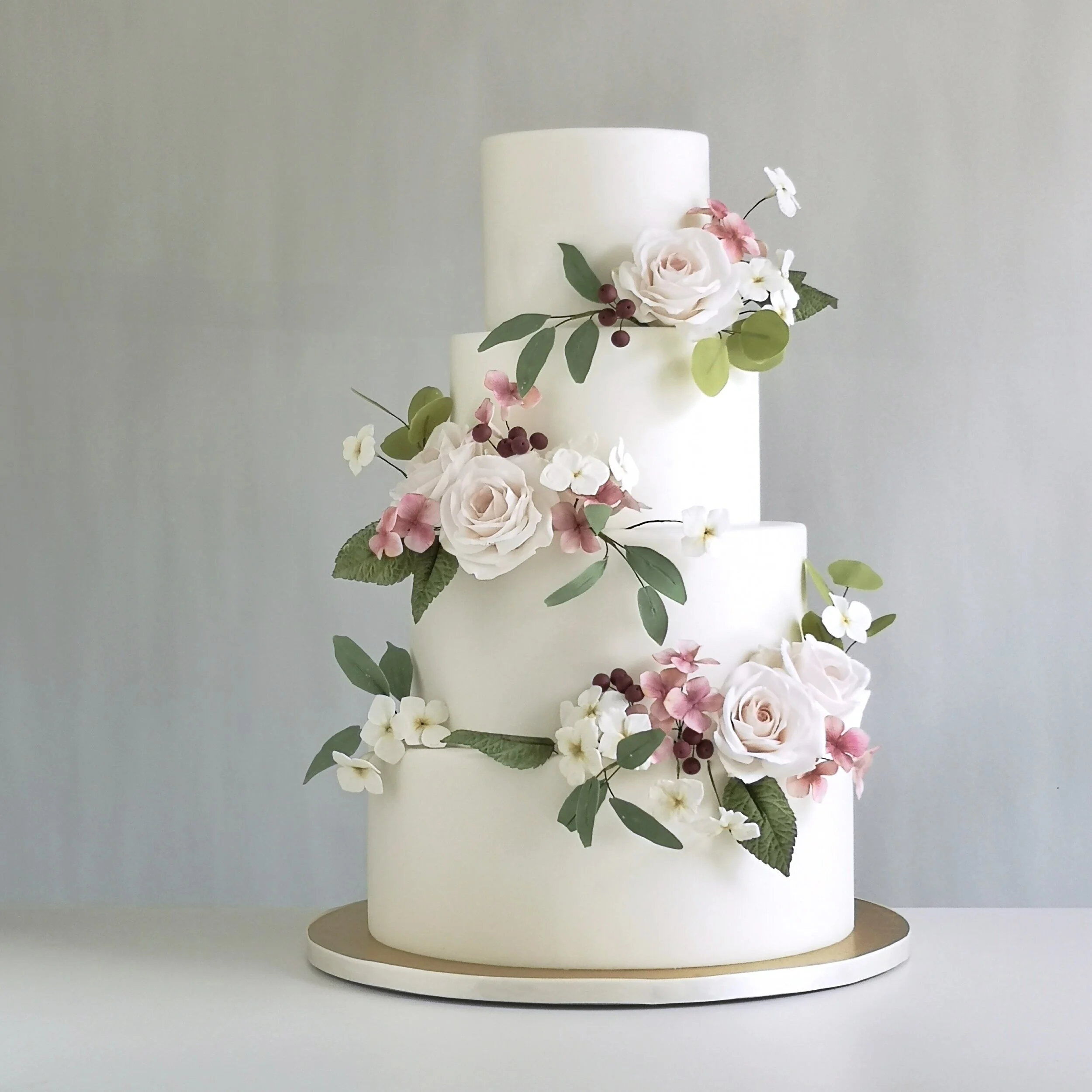 Gorgeous modern wedding cake decorated with handmade sugarflowers by Crummb Cakes, Singapore's top wedding cake vendor.