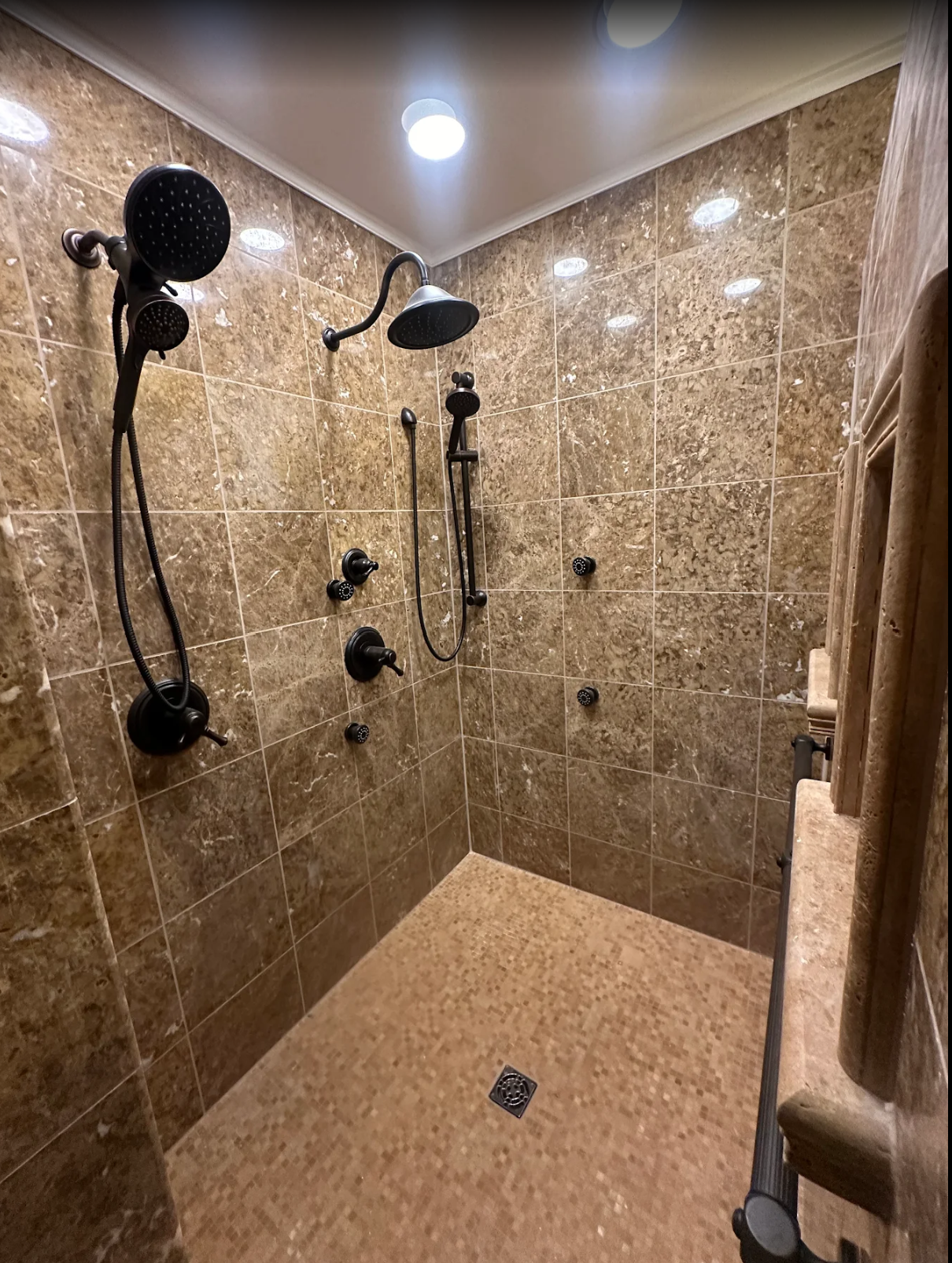 Double shower with natural marble stone in Brookfield, CT
