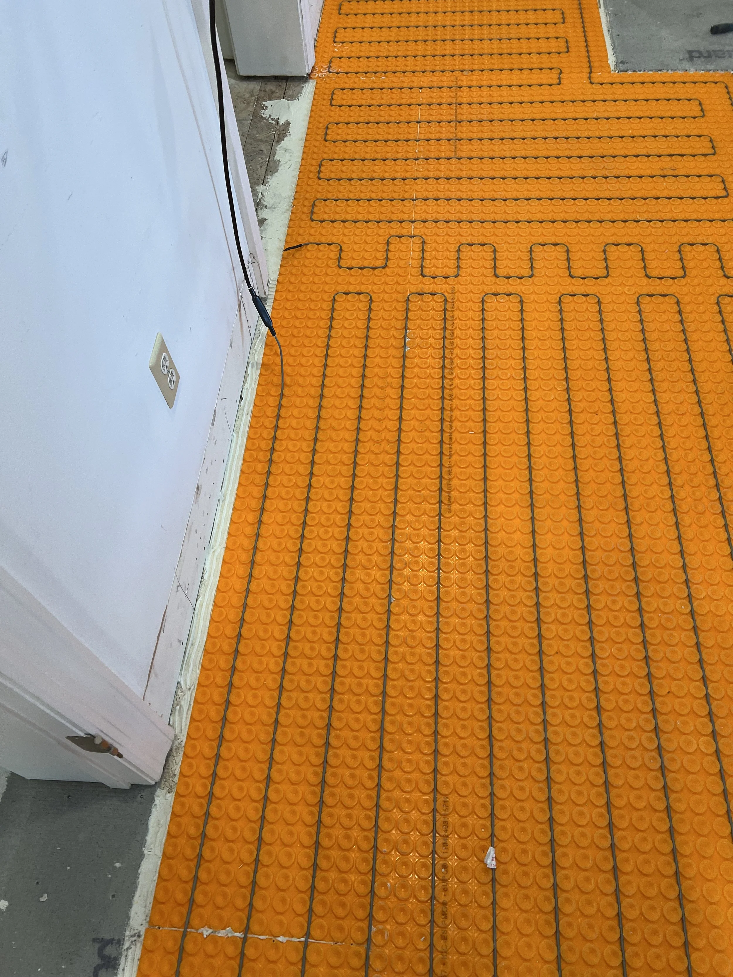 Heated flooring can be installed in bathroom and kitchen.