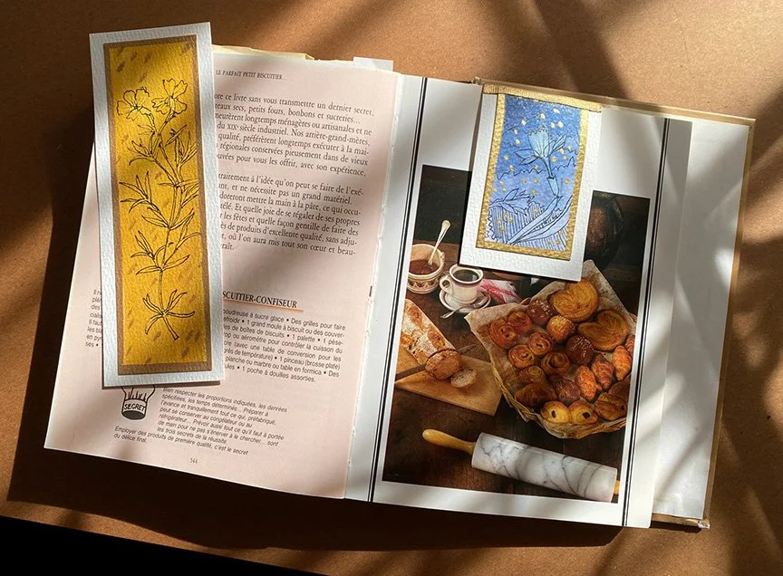 My favorite cookbook with two bookmarks, one regular and one magnetic.