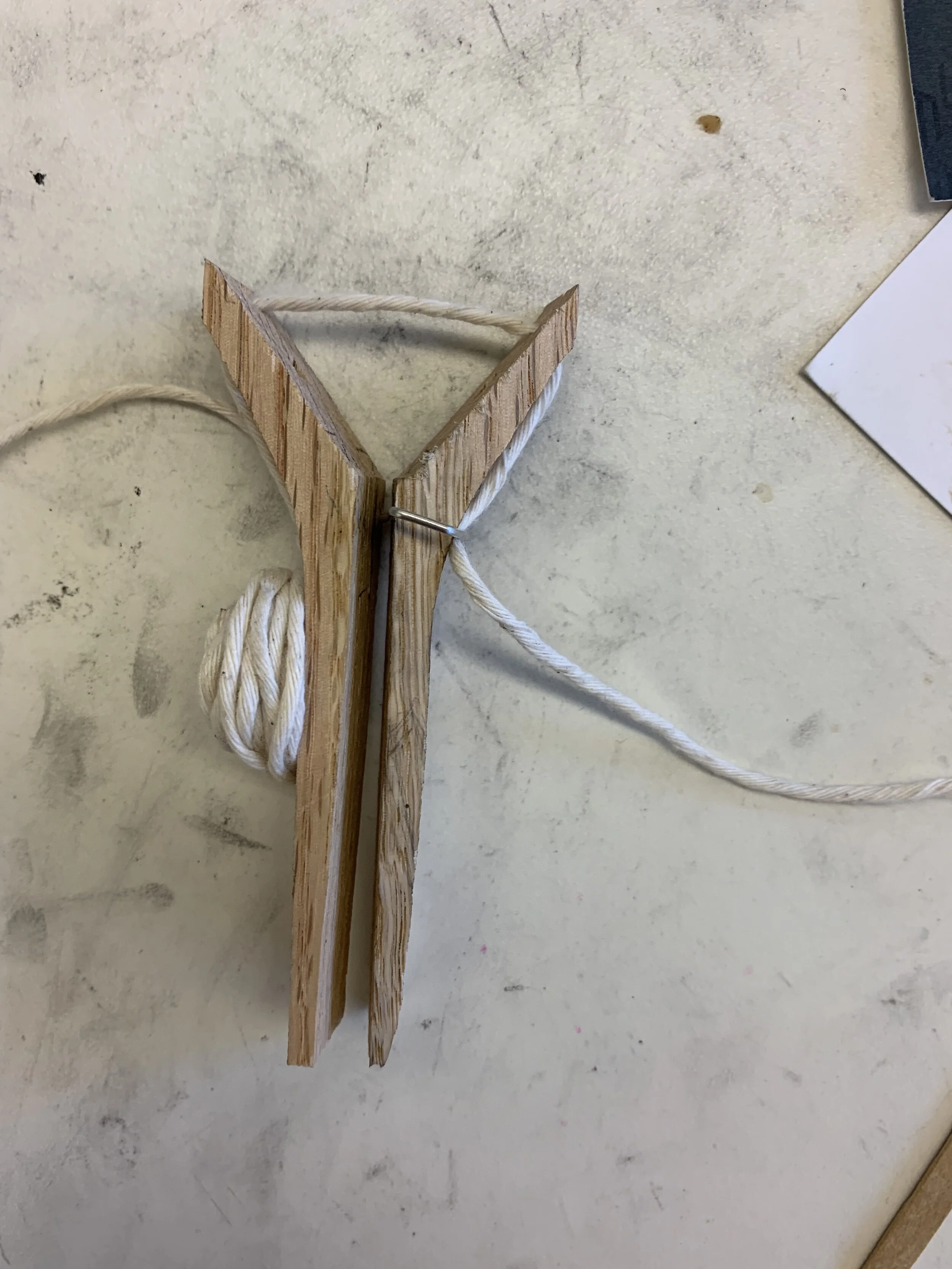 Rapid prototype made by inverting a clothes pin. I learned from this prototype that keeping symmetry in the design would keep structural integrity of the product. I also learned that external floss housing made the product awkward to hold. 