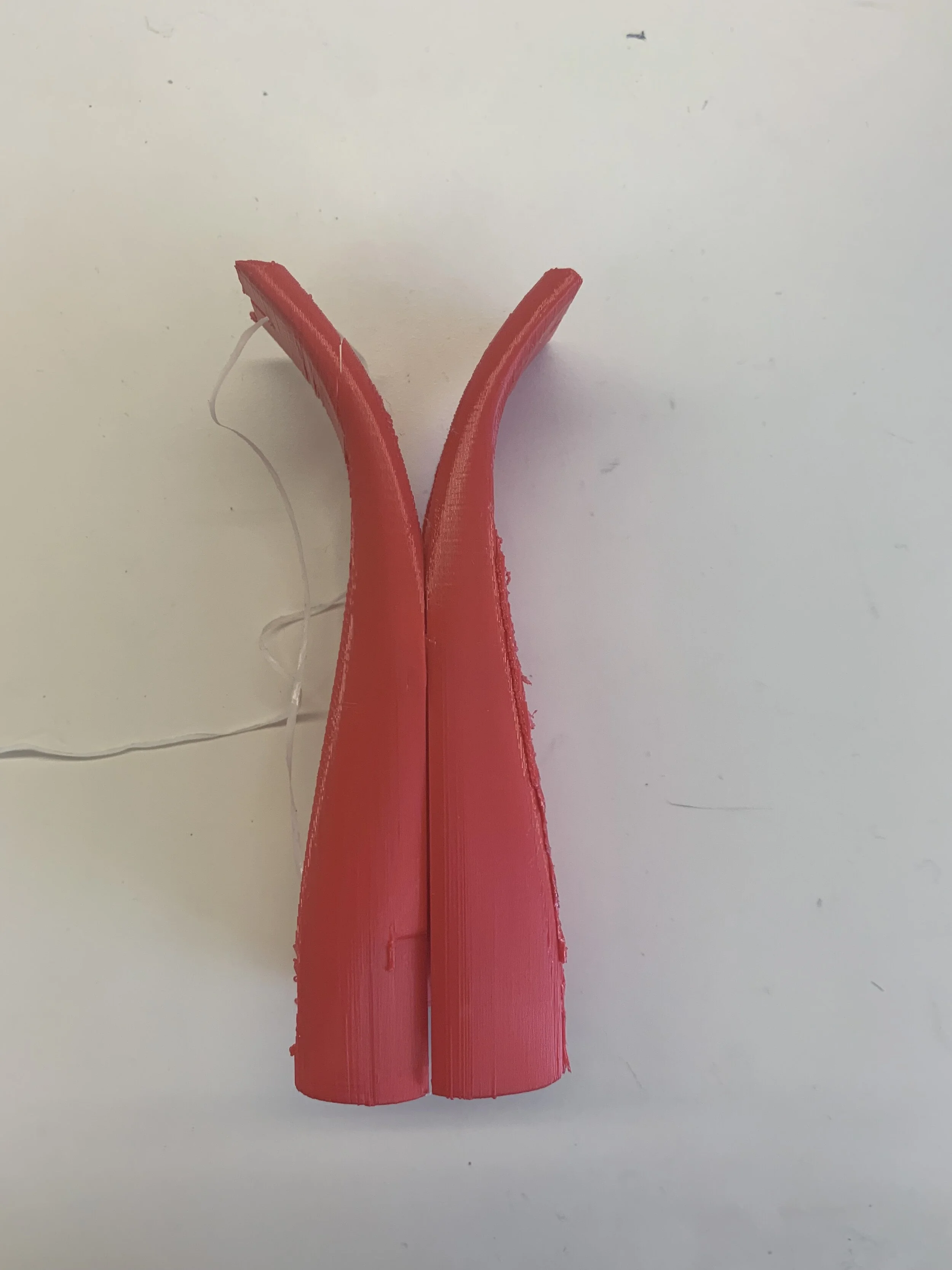 This 3D printed floss holder is composed of two separate symmetrical pieces that connect. 