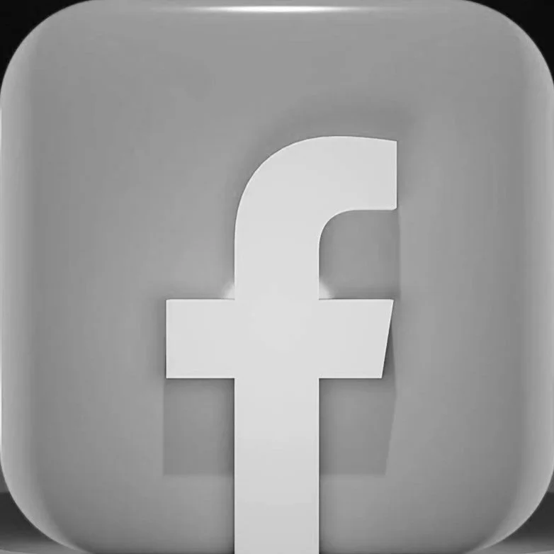 Black and white image of the Facebook logo, a stylized lowercase 'f' on a square background.