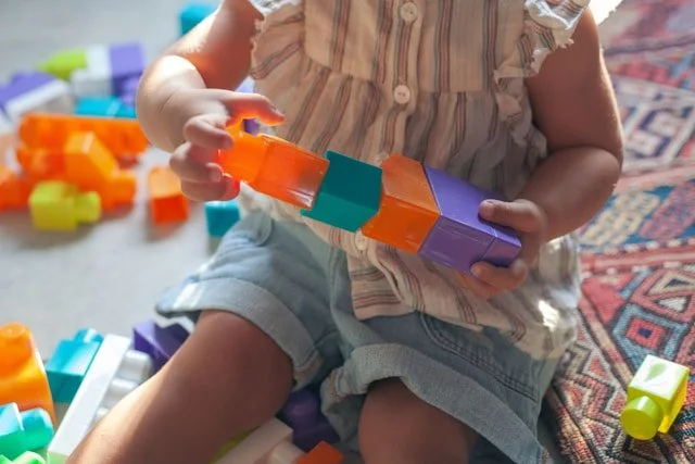 child playing with building blocks