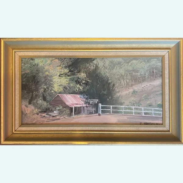 John Hansen (1989) Raspberry Creek shed in Victoria, framed rural scene with red tin roof, white fence, and creek-side bushland.