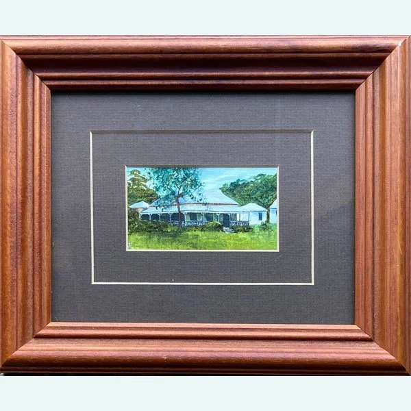 Miniature painting by John Thiessen showing a white-roofed timber house with wrap-around veranda, surrounded by trees and green lawn under a pale blue sky