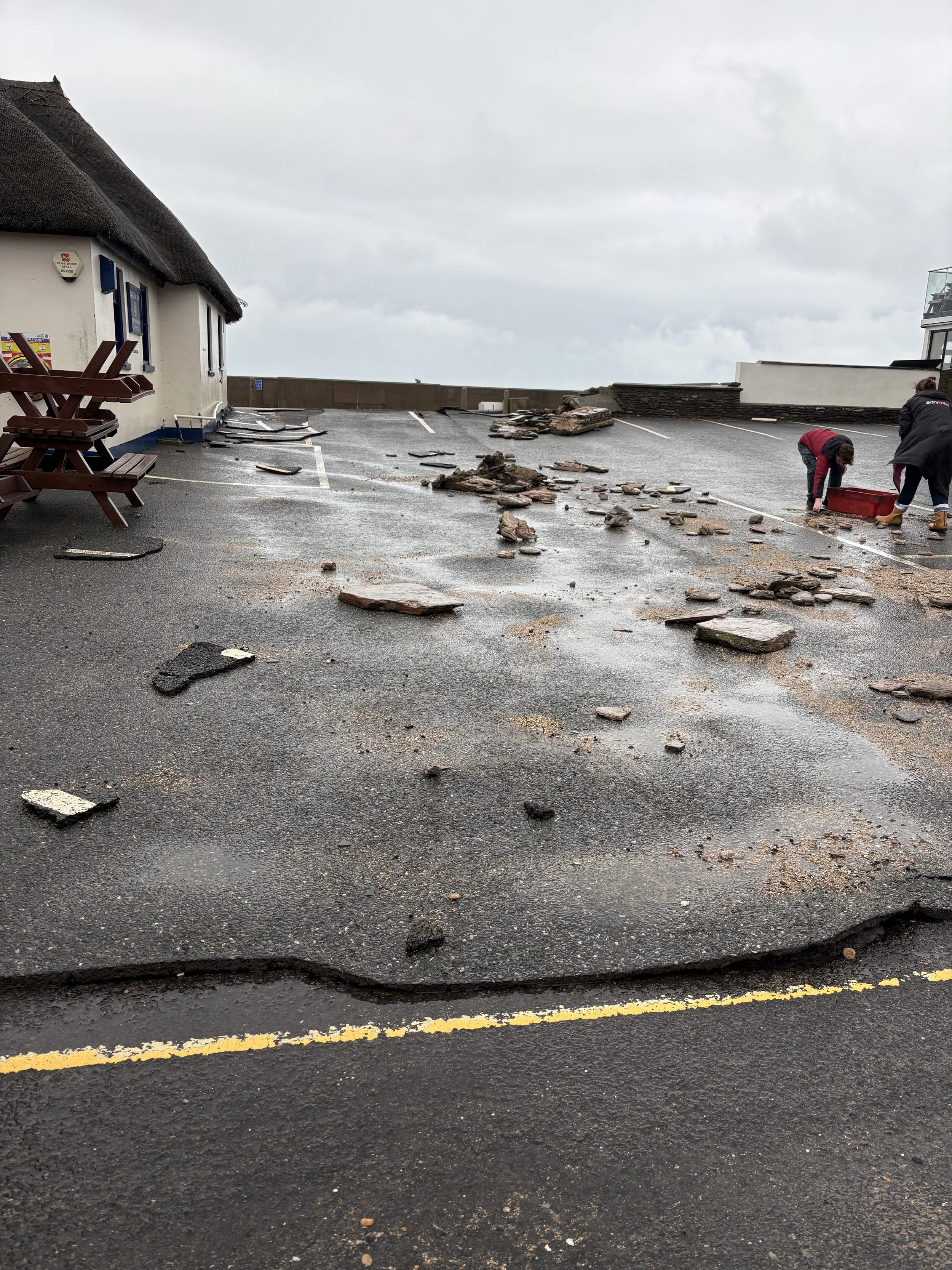 The carpark peeled and slid with the friction of the water
