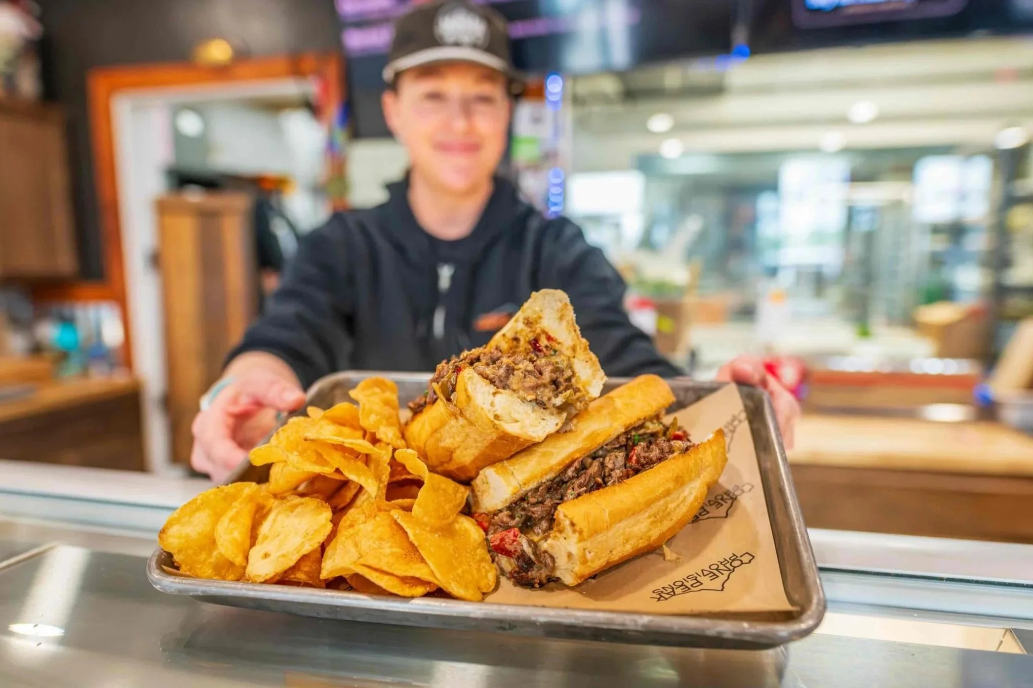 Our cheesesteak sandwich makes a delicious pairing with our home made beef fat potato chips.