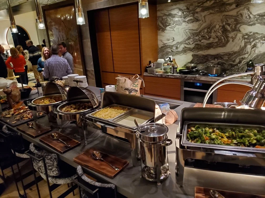 A professionally set buffet table at a corporate event catered by Lone Peak Provisions in Bozeman, Montana, offering full-service catering for businesses and organizations across the Gallatin Valley.