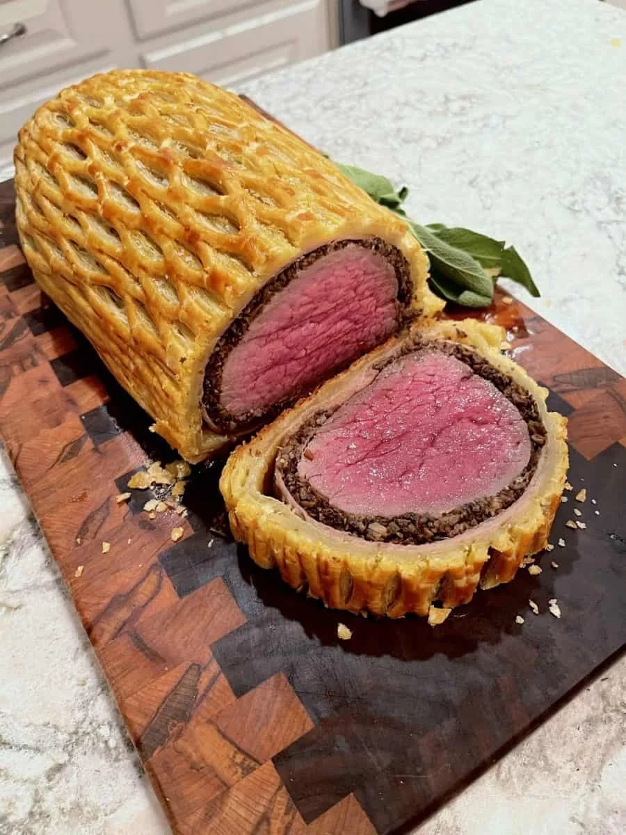 Sliced beef wellington served as a plated dinner entrée option for catered events by Lone Peak Provisions in Bozeman, Montana.