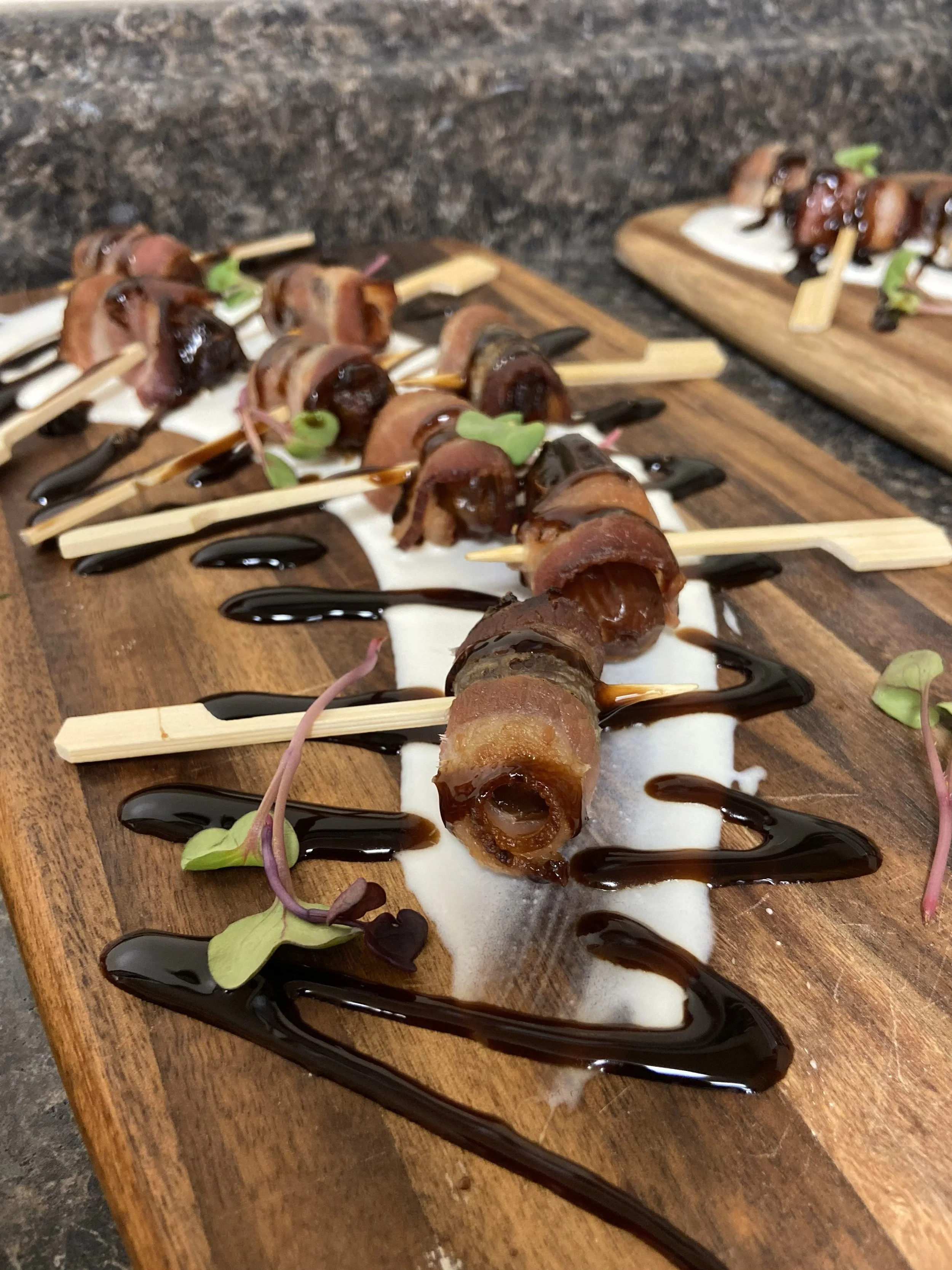 Bacon wrapped dates prepared as a custom hors d'oeuvre for a catered event by Lone Peak Provisions in Bozeman, Montana — made to order for any occasion, just ask.