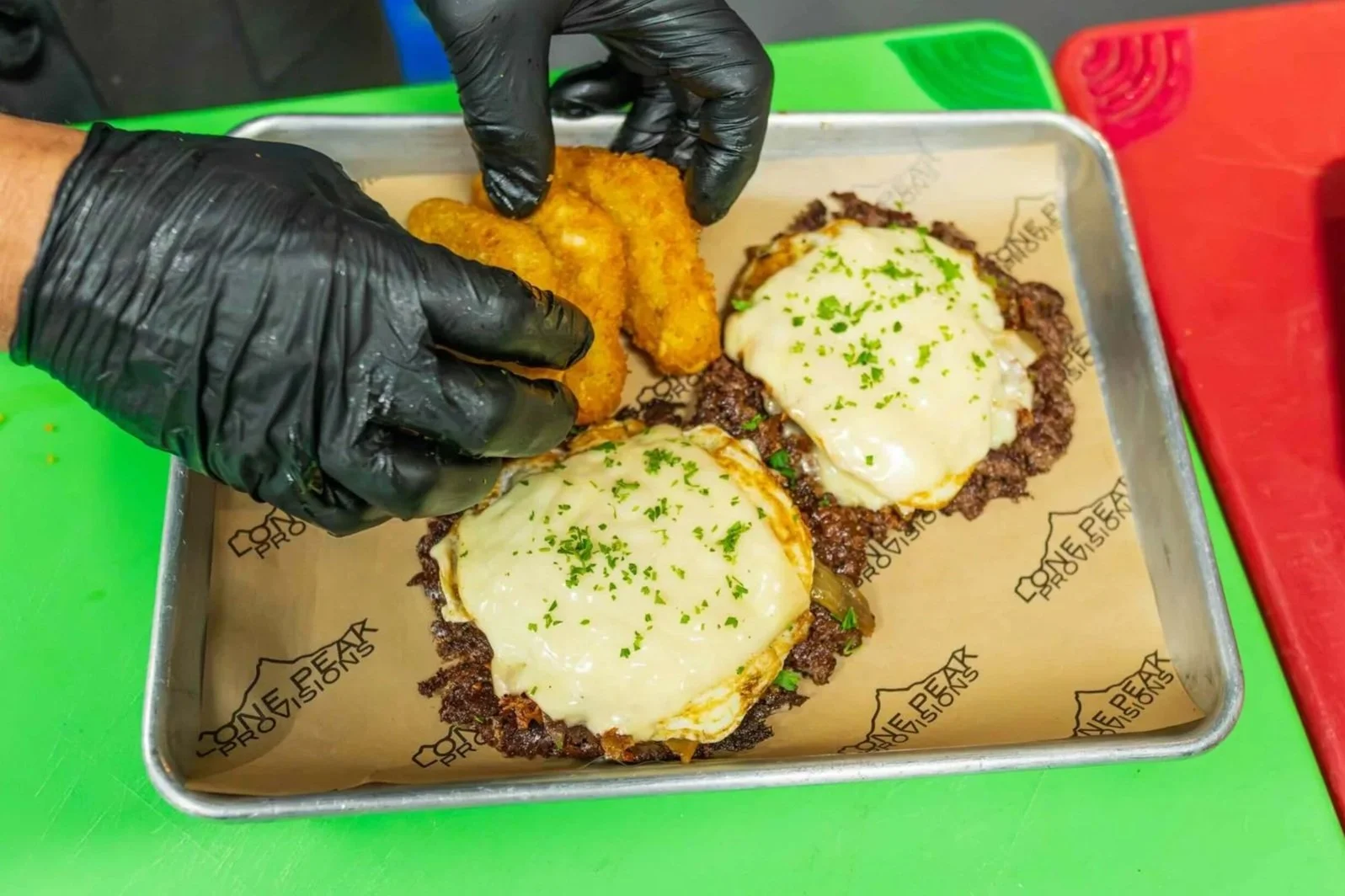 The Mountain Man breakfast platter includes beef patties, beef fat hashbrowns and more. Available at Lone Peak Provisions on our breakfast menu.