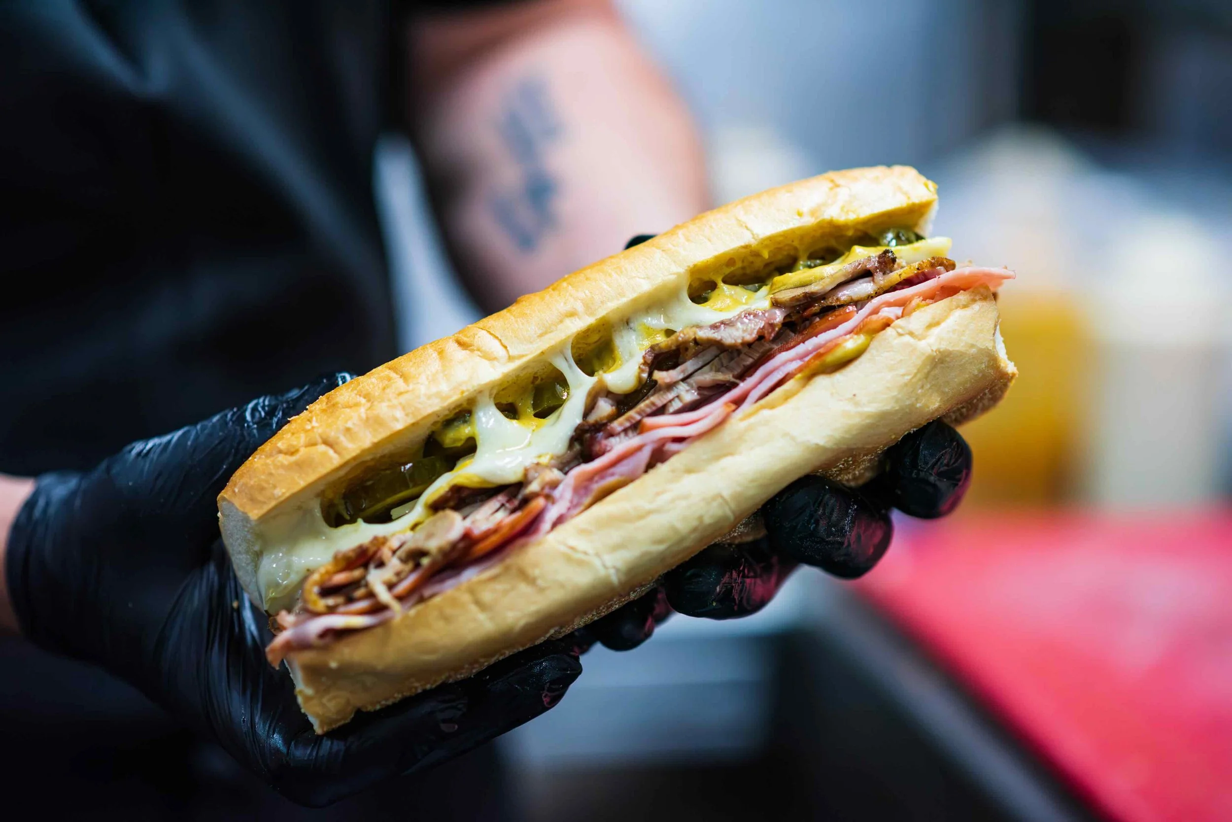 We made our sandwiches to order, this cubano has sliced ham, pulled pork, pickles and more.
