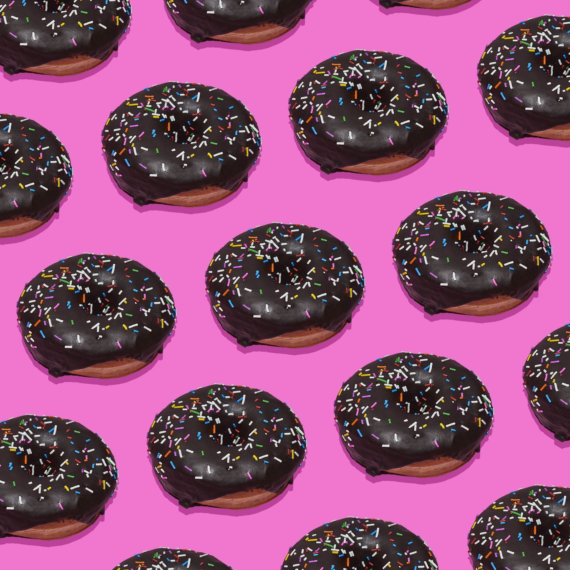 Donuts on a pink background, commercial photography