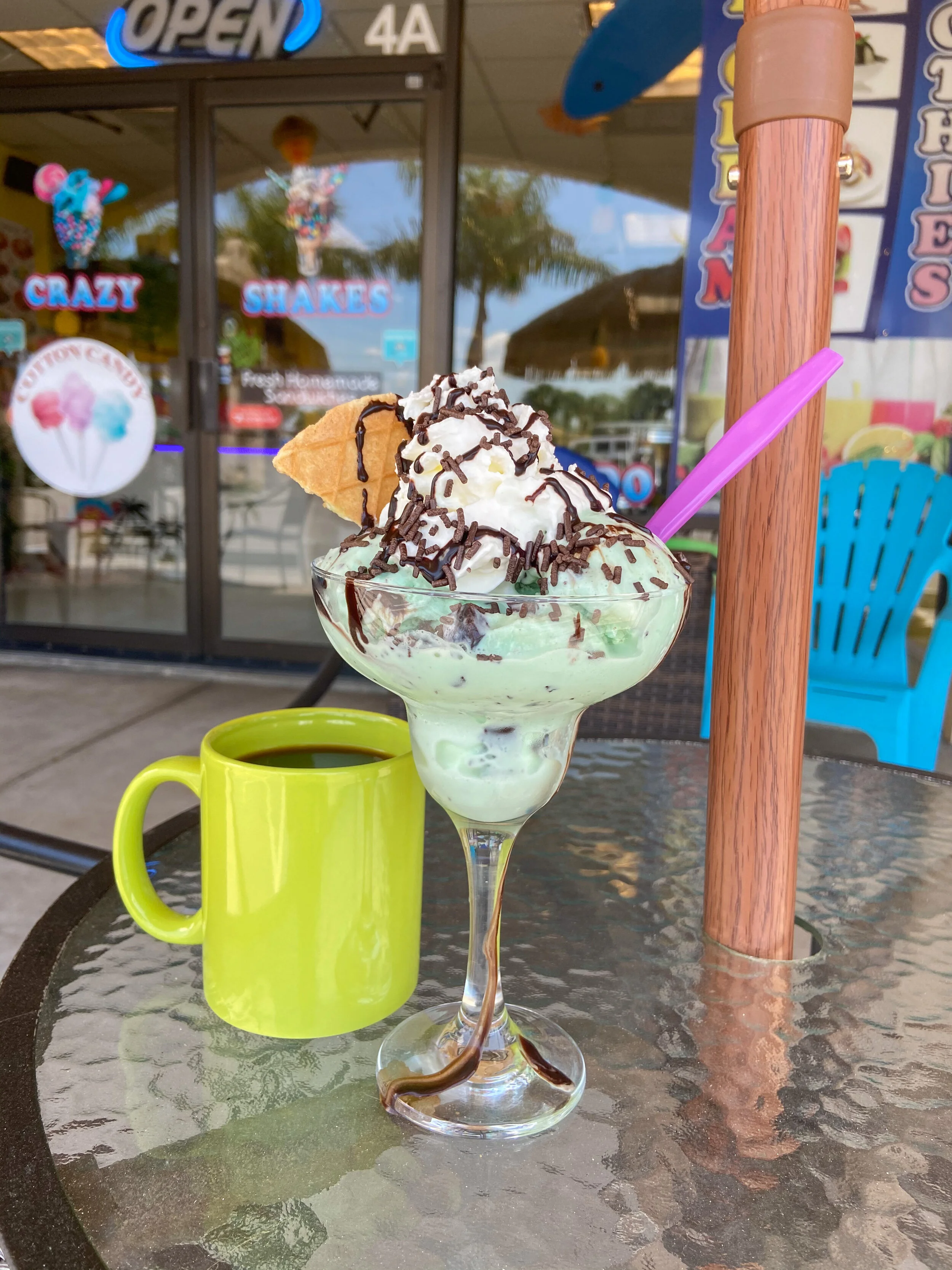 Mint chocolate chip ice cream with a coffee to the left of it