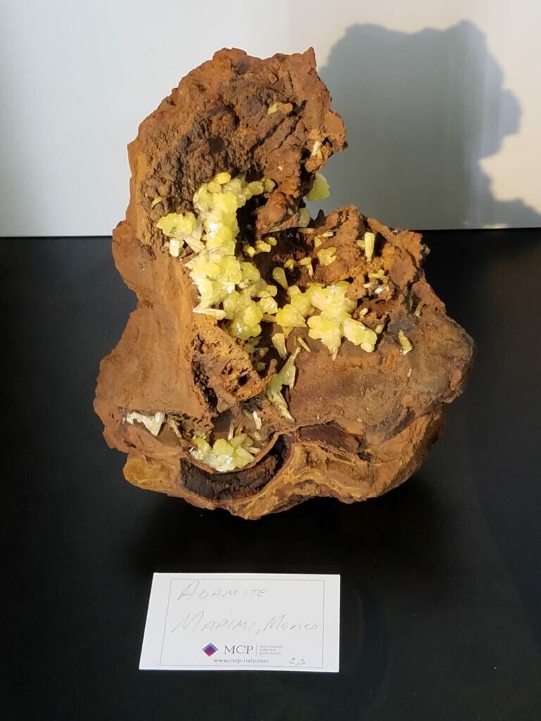 Check out these images form the show display! Here is a choice large plate of yellow adamite on rusty colored Gossan matrix from Ojuela.