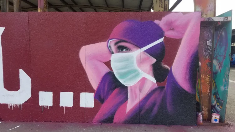 Hand-painted outdoor building mural by Lase 28 in Visalia California