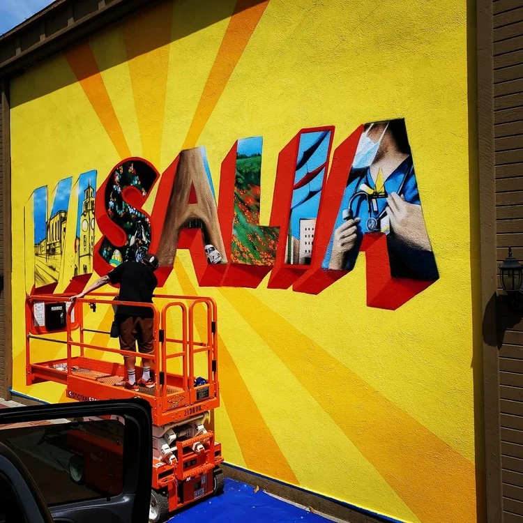 Custom outdoor mural painting by Lase 28 in California