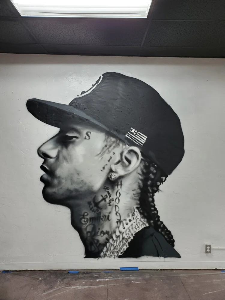 Large-scale city mural project by Lase 28 public art muralist