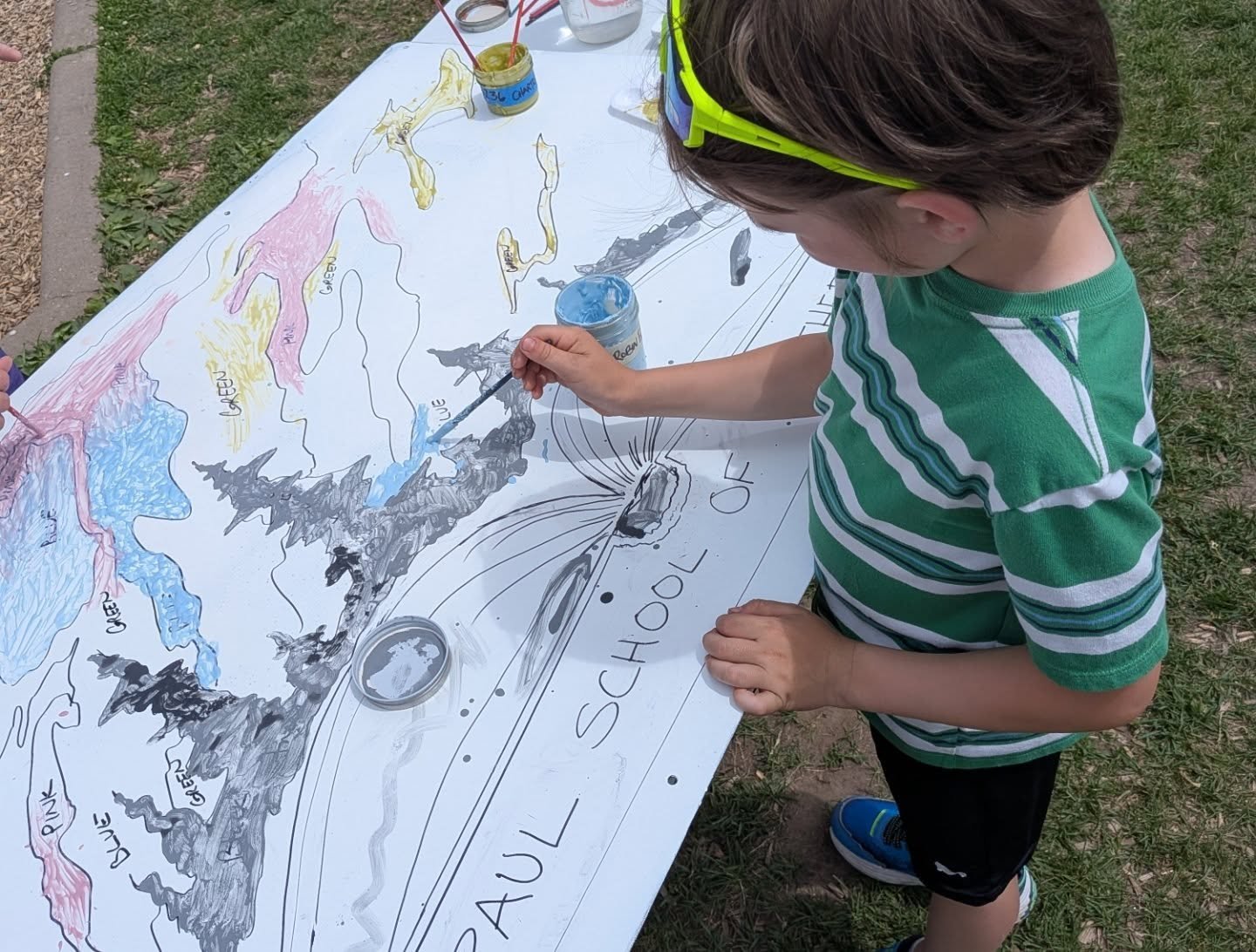 Today I had the pleasure of adding Pedal to the Metal to the St Paul School of Northern Lights end of year picnic. We worked together to design and fabricate glass enamel artwork for their school. Today students were able to paint vitreous enamel onl