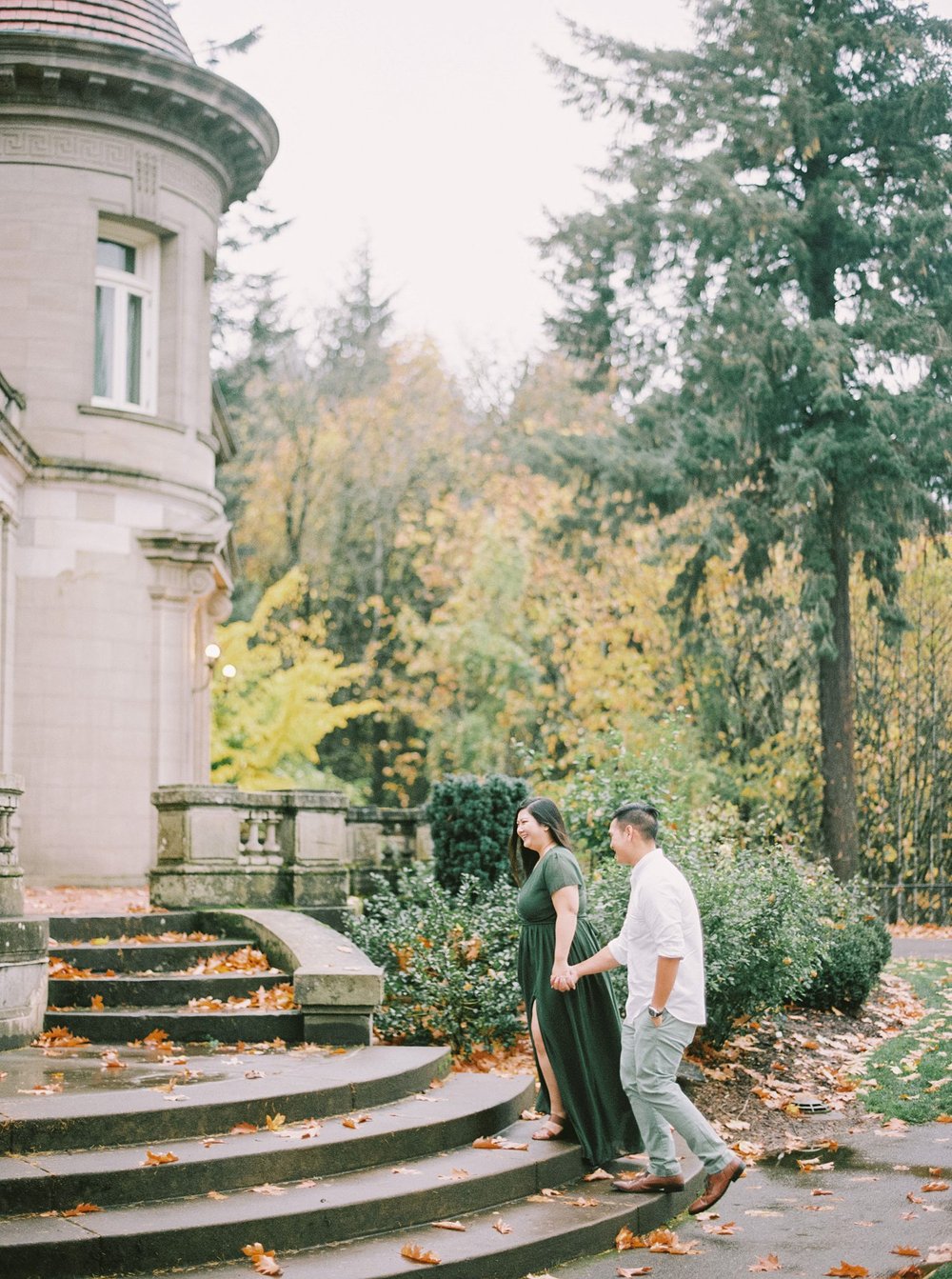 Couple walking up stairs at Pittock Mansion