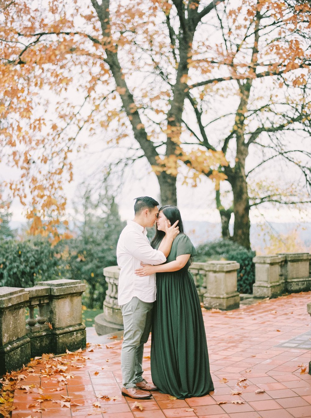 Couple posing under Fall leaves