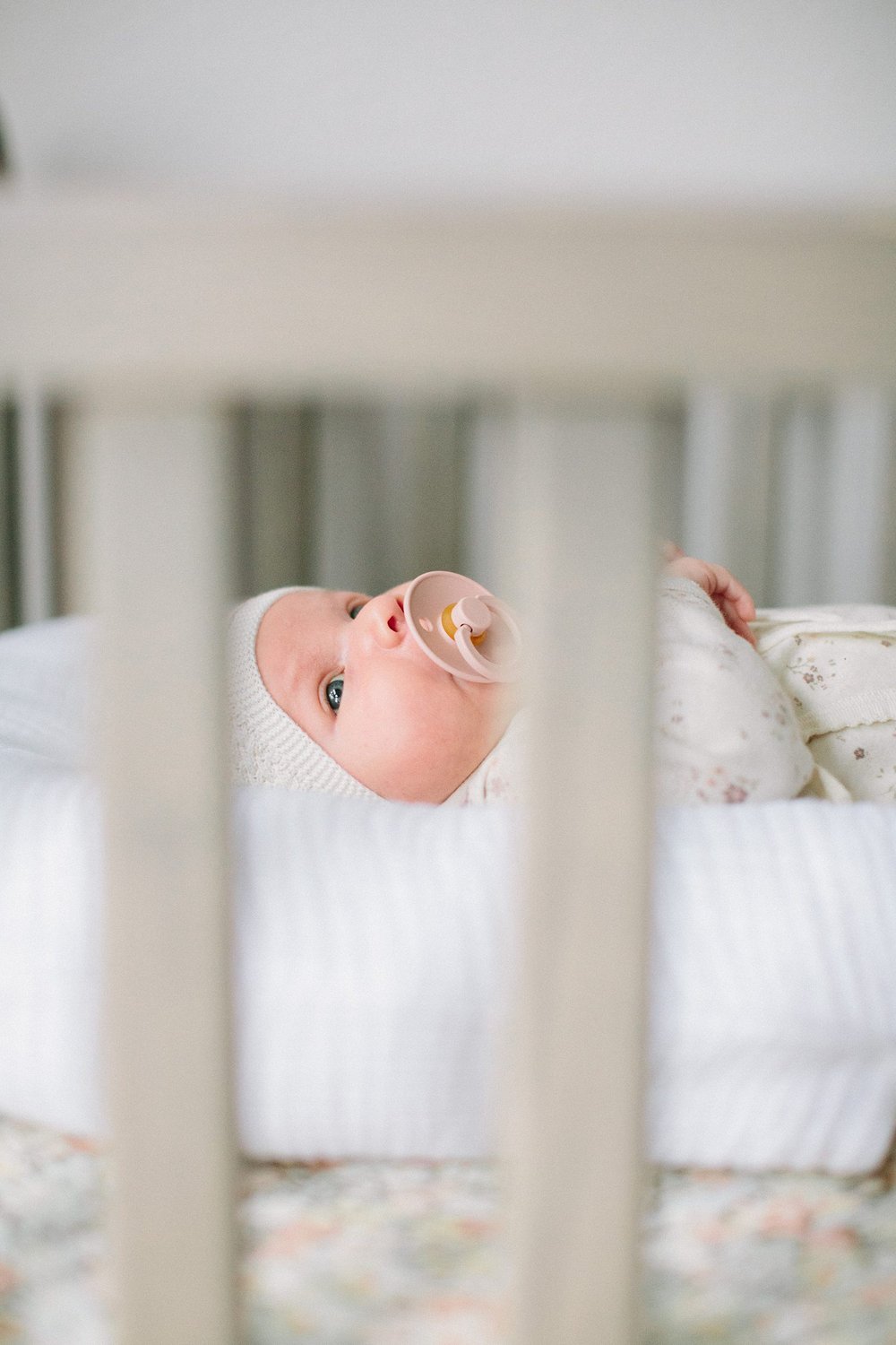 cute newborn in crib in Portland Oregon